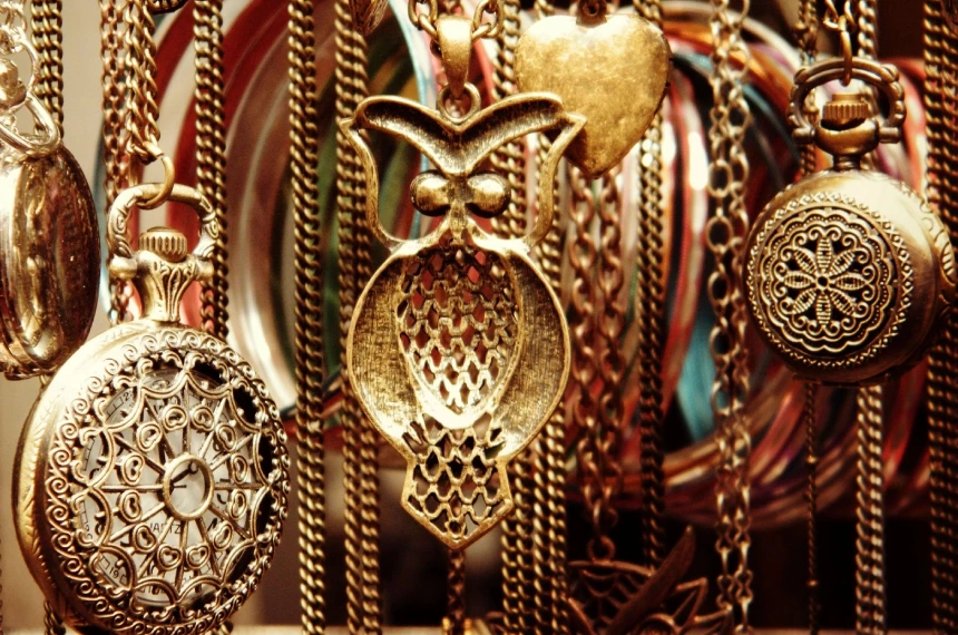 A close up of many different necklaces hanging