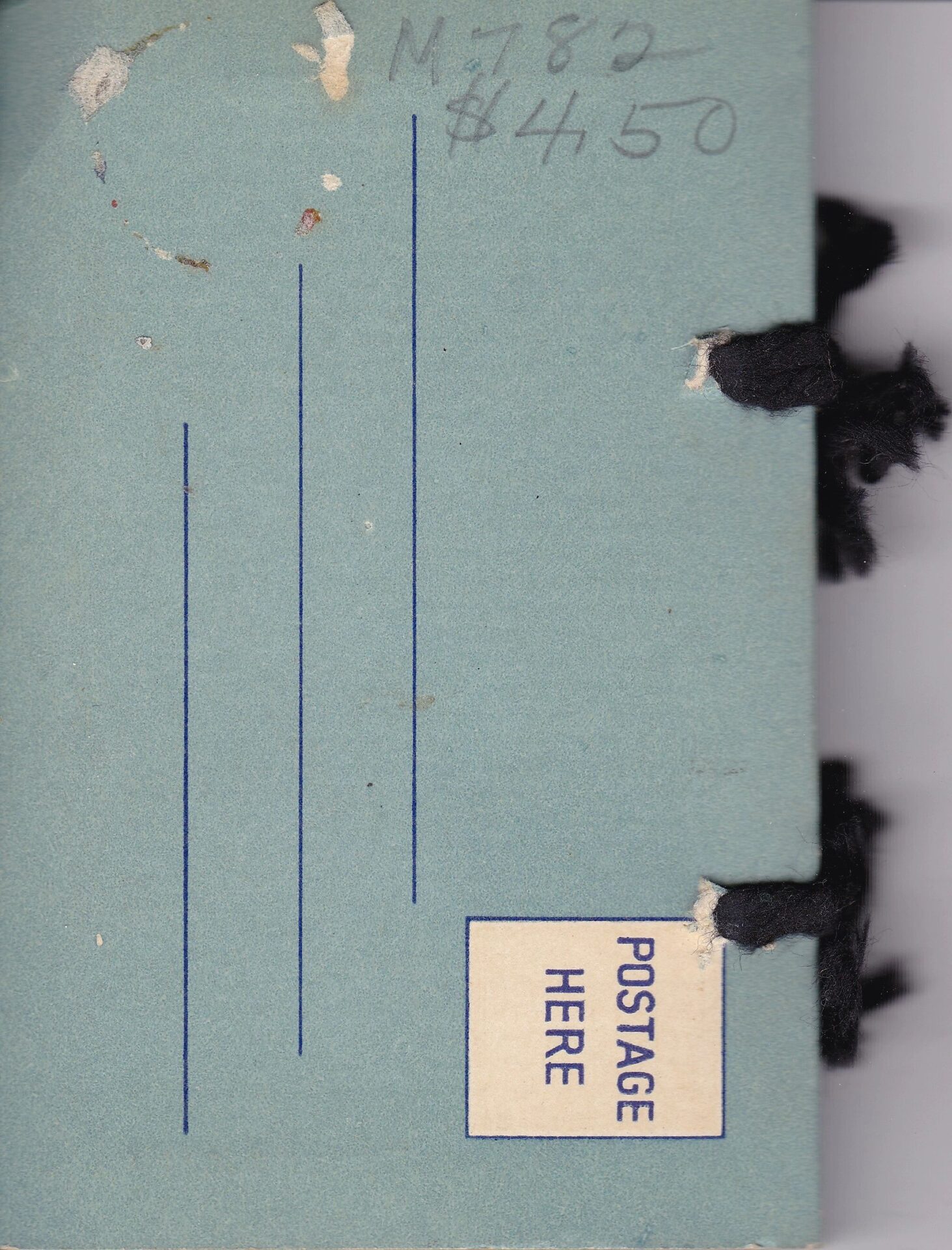 A light blue mailing envelope for "Gettysburg Souvenir Views of the Battlefield" with handwritten “M780 $4.50,” blank address lines, a “POSTAGE HERE” label, and black threads visible on the right side.