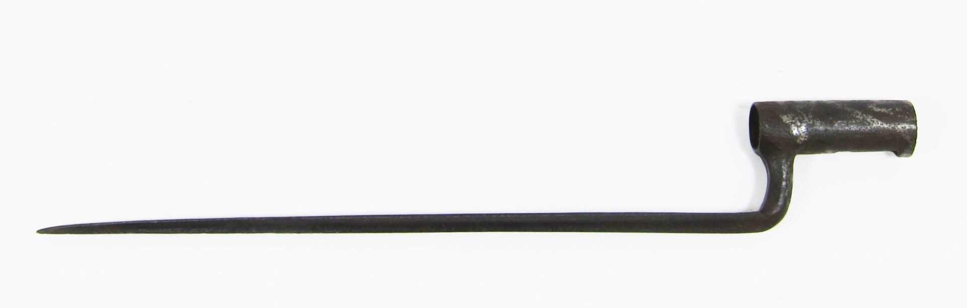 The U.S. Socket Bayonet features a cylindrical metal socket and a long, tapered, pointed blade that extends straight from the socket.