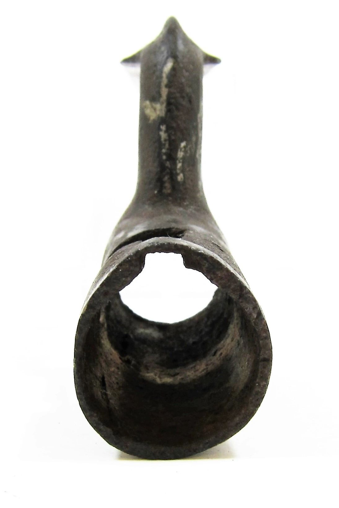 A close-up, front-facing view of a U.S. Socket Bayonet—an old, rusty, hollow metal tool with a round opening and pointed top—set against a white background.