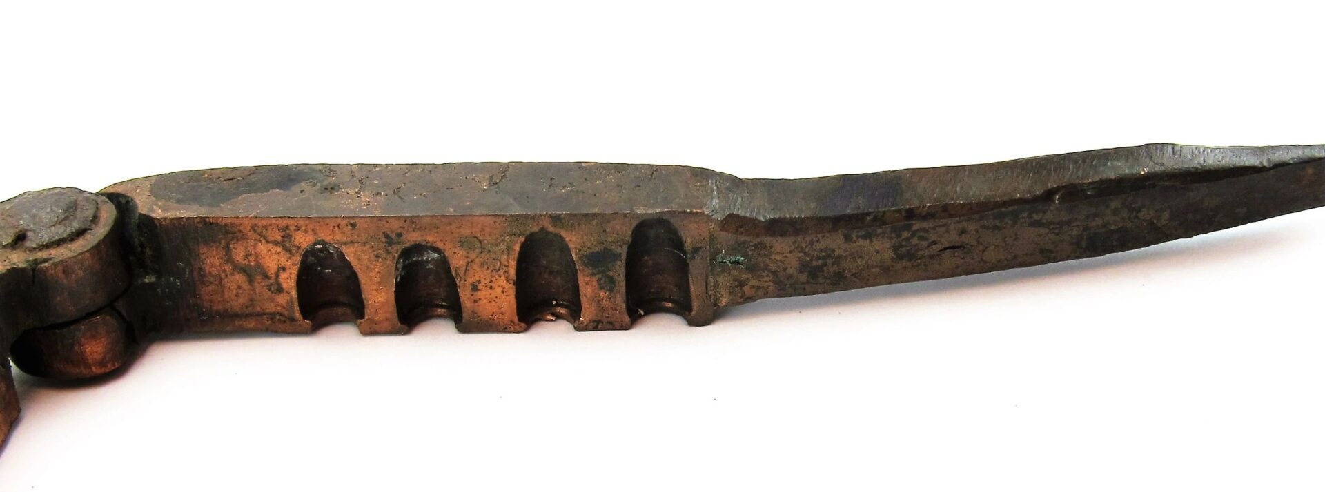 Civil War Era Bullet Gang Mold with a pointed end and four grooved notches along the side, shown against a white background.