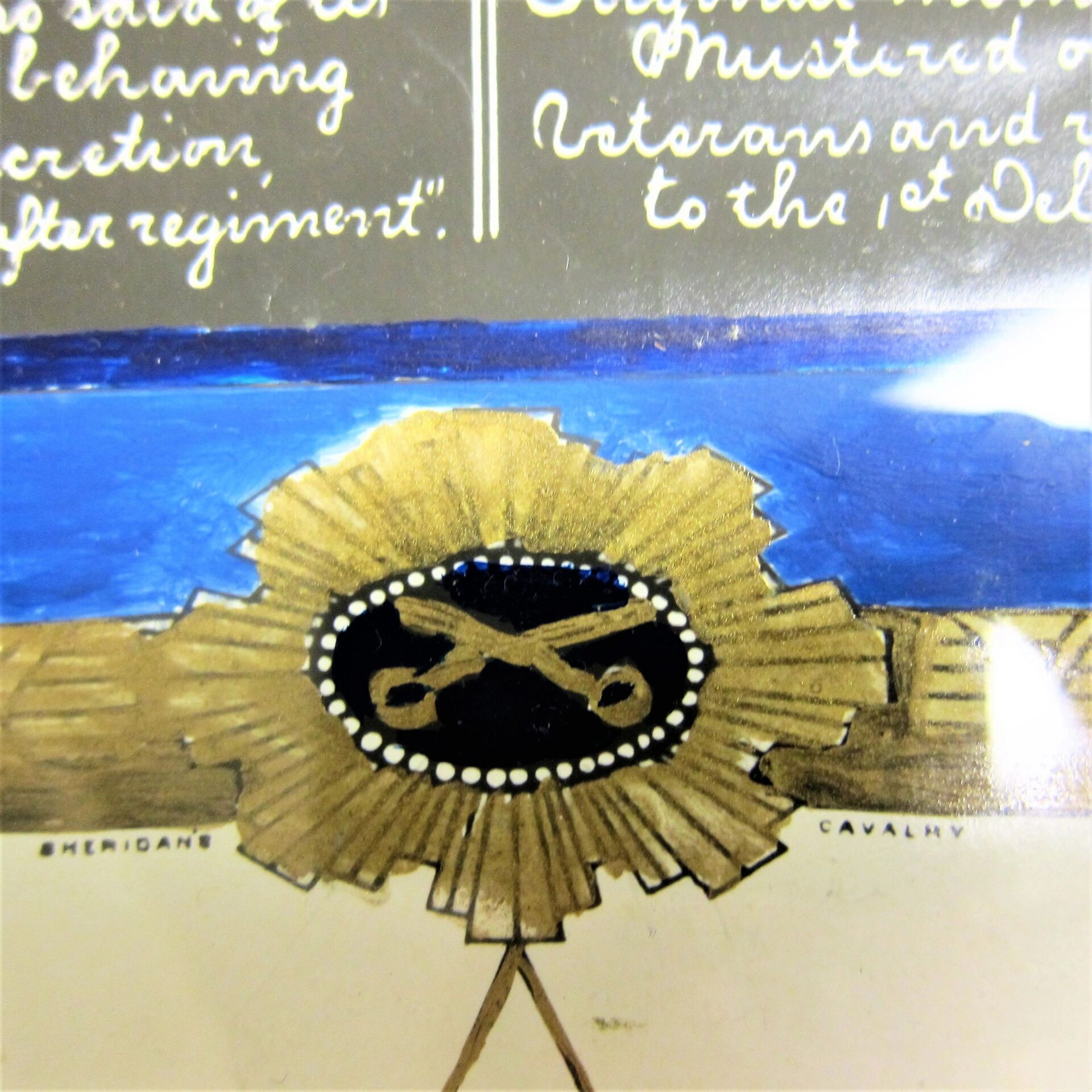 Close-up of the Military Escutcheon of Francis Renshaw, 2nd Delaware Volunteer Infantry, displayed on a decorative background with blue and handwritten text above. Sold.
