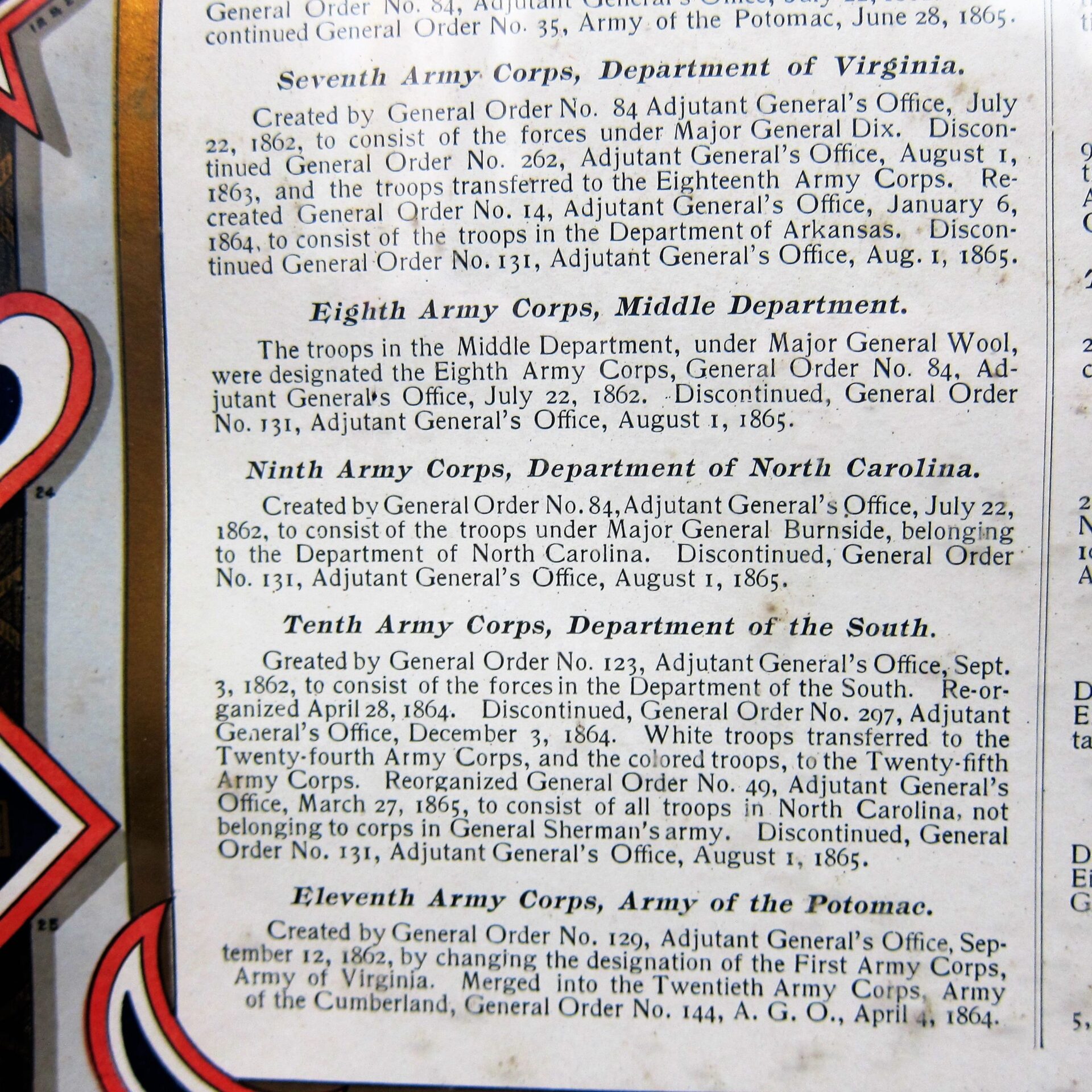 A close-up of the US Army Corp Escutcheon displaying historical details about the Seventh through Eleventh Army Corps, with dates, locations, and commanding officers.