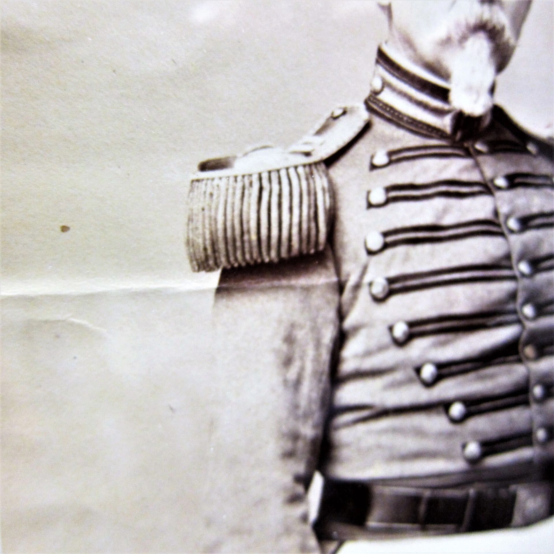 Albumen photo showing the upper body of Brevet Colonel Henry C. Shumway, Captain of the 8th Company National Guard, 7th Regiment NYSM, in uniform with decorative buttons and an epaulet; his face is partially out of frame.