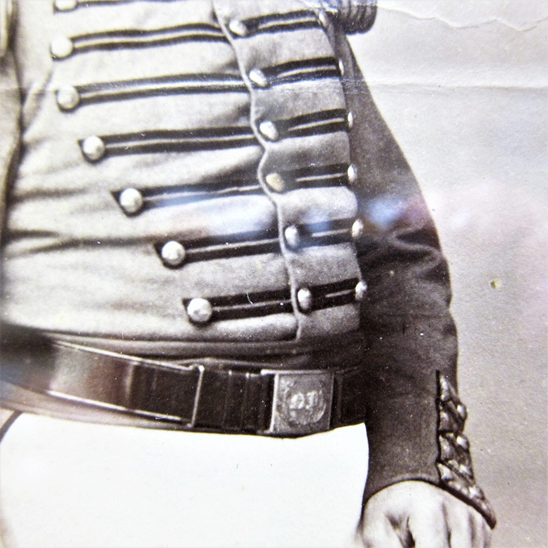 A close-up shows Brevet Colonel Henry C. Shumway, Captain of the 8th Company, 7th Regiment NYSM, in uniform with decorative buttons, shoulder epaulette, and belt, from shoulders to waist (albumen print).