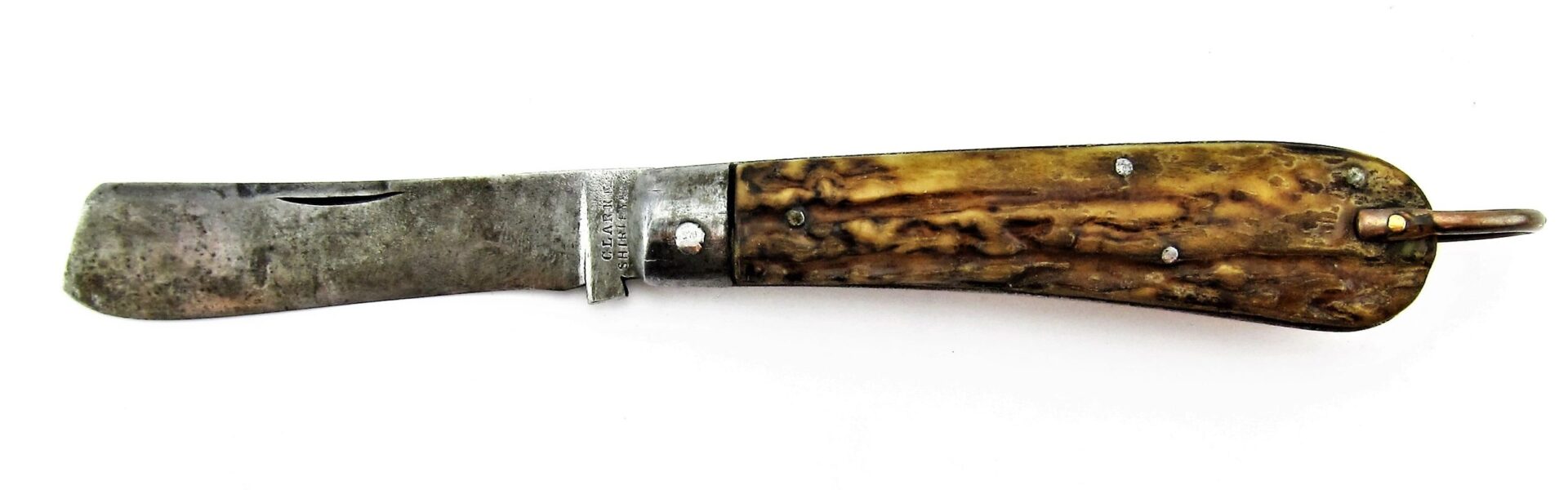 A Rare Civil War Era Navy Sailor's Working Pocket Knife with a worn, rounded blade and textured brown handle is displayed open against a white background. / SOLD.