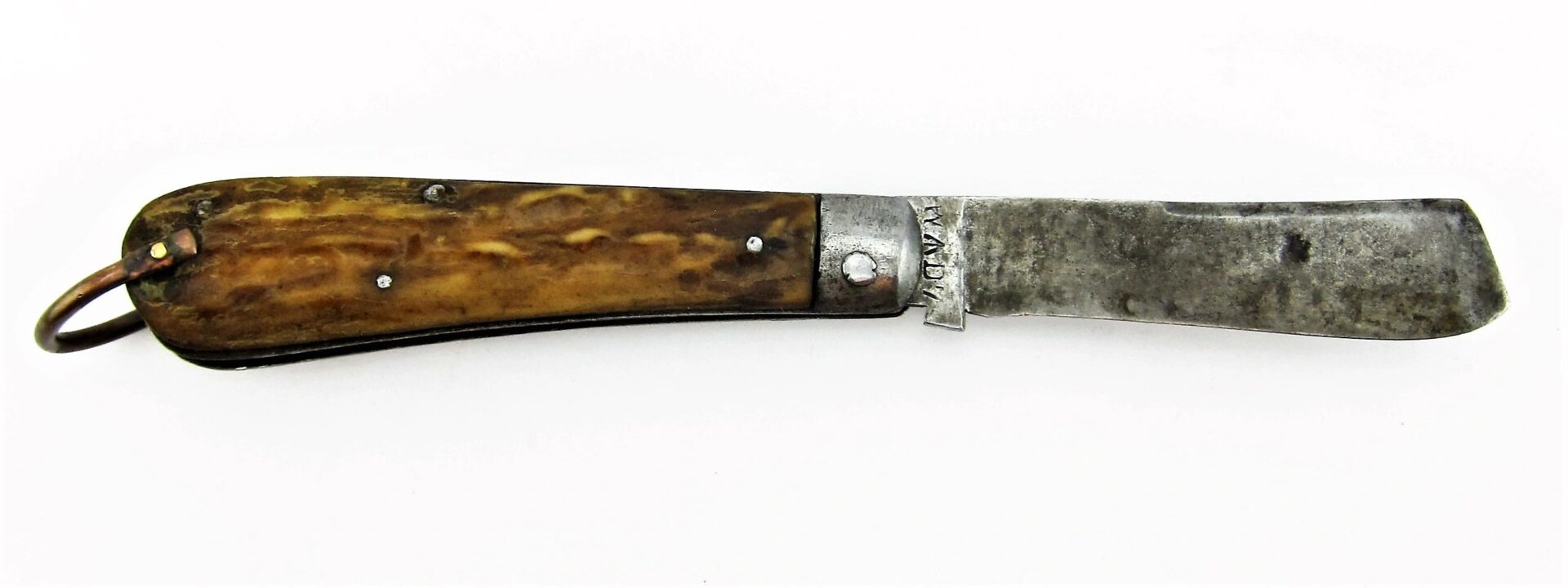 A Rare Civil War Era Navy Sailor's Working Pocket Knife with a worn metal blade, brown wooden handle, visible rivets, and a metal ring at the end. / SOLD.