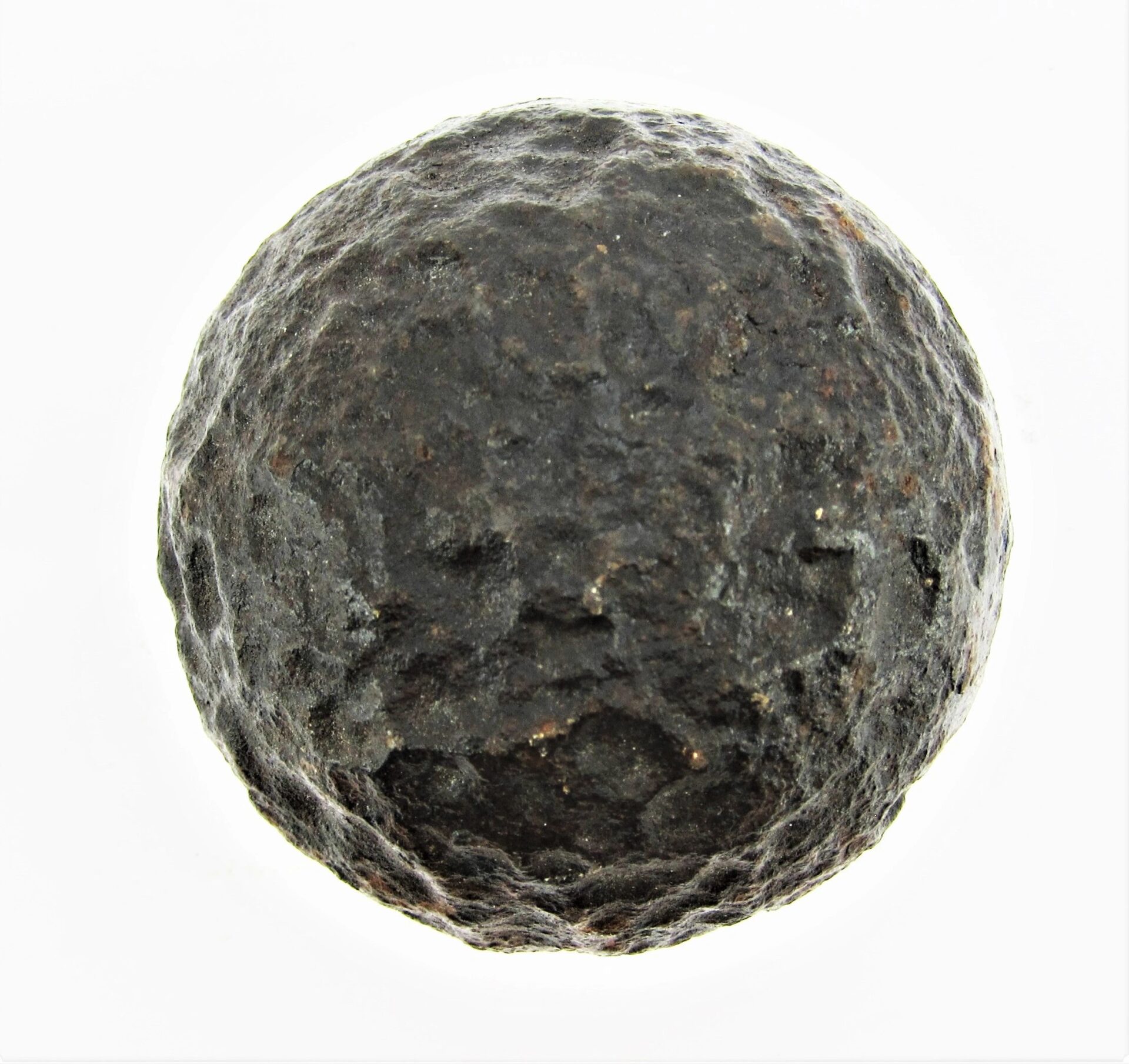A 6 Pound Bormann Artillery Shell displayed as a round black object against a white background.