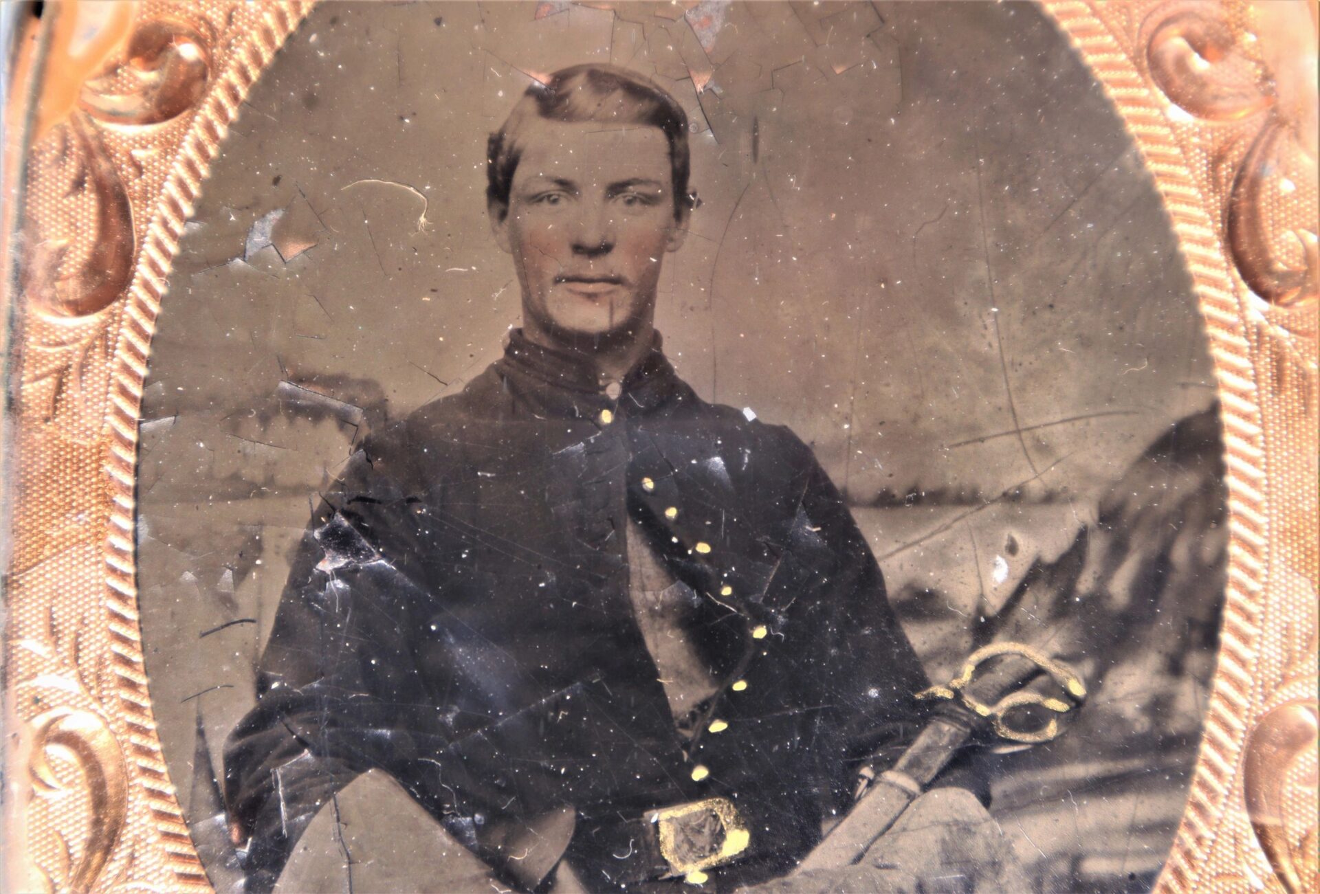 Historic portrait titled "Cavlary Image" shows a seated man in uniform with brass buttons, holding a sword, framed by an ornate border. The aged image displays visible scratches and fading.