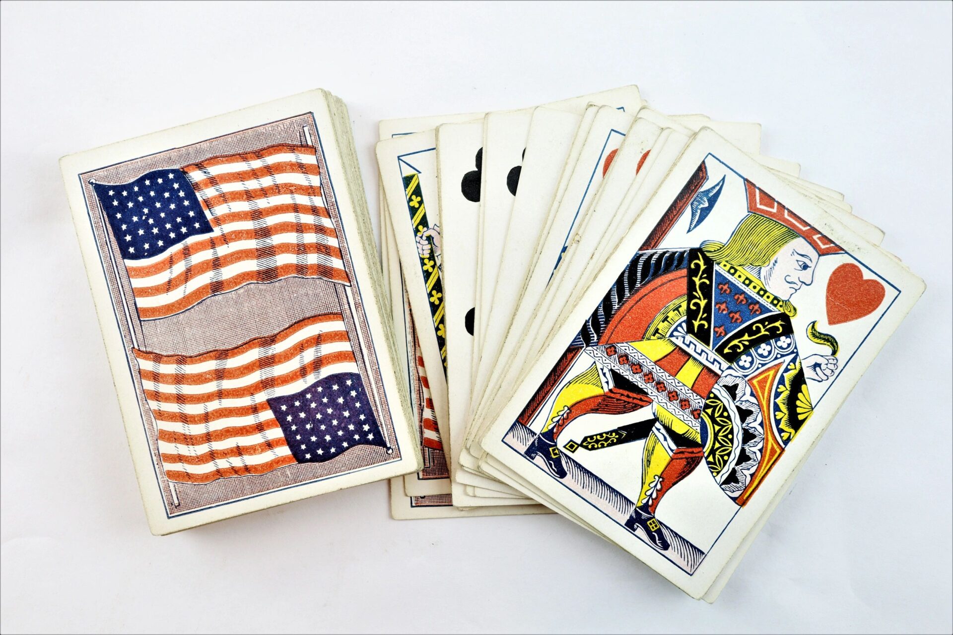 A deck of Civil War Playing Cards identified to Private Francis A. Tuck, 17th Massachusetts Infantry, is spread out, showing various face and numbered cards, including a King of Hearts.