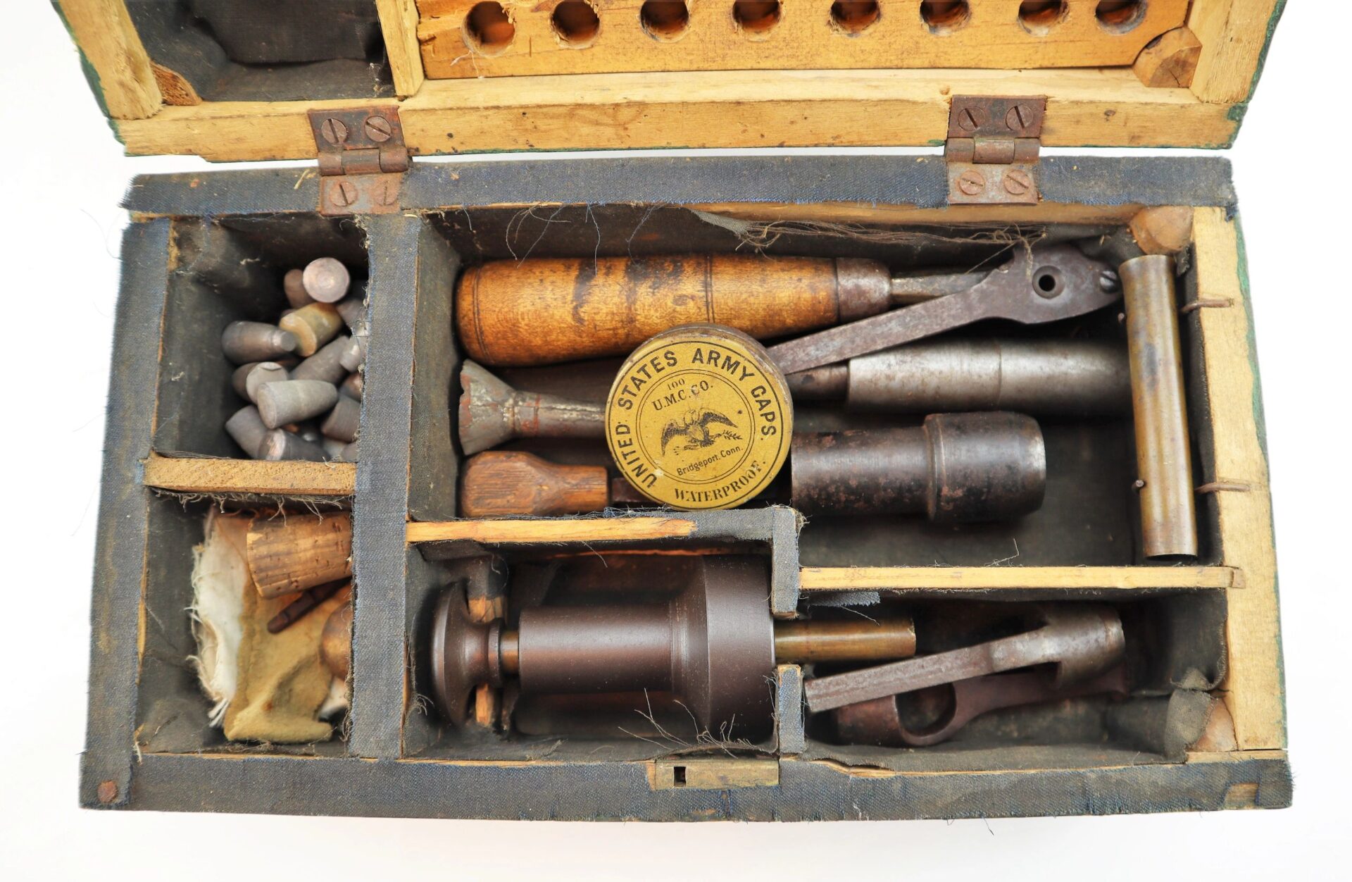 A vintage "Target Rifle" Box Sharpshooters Display featuring assorted metal tools, lead bullets, and a circular United States Army Ordnance label in the center compartment.