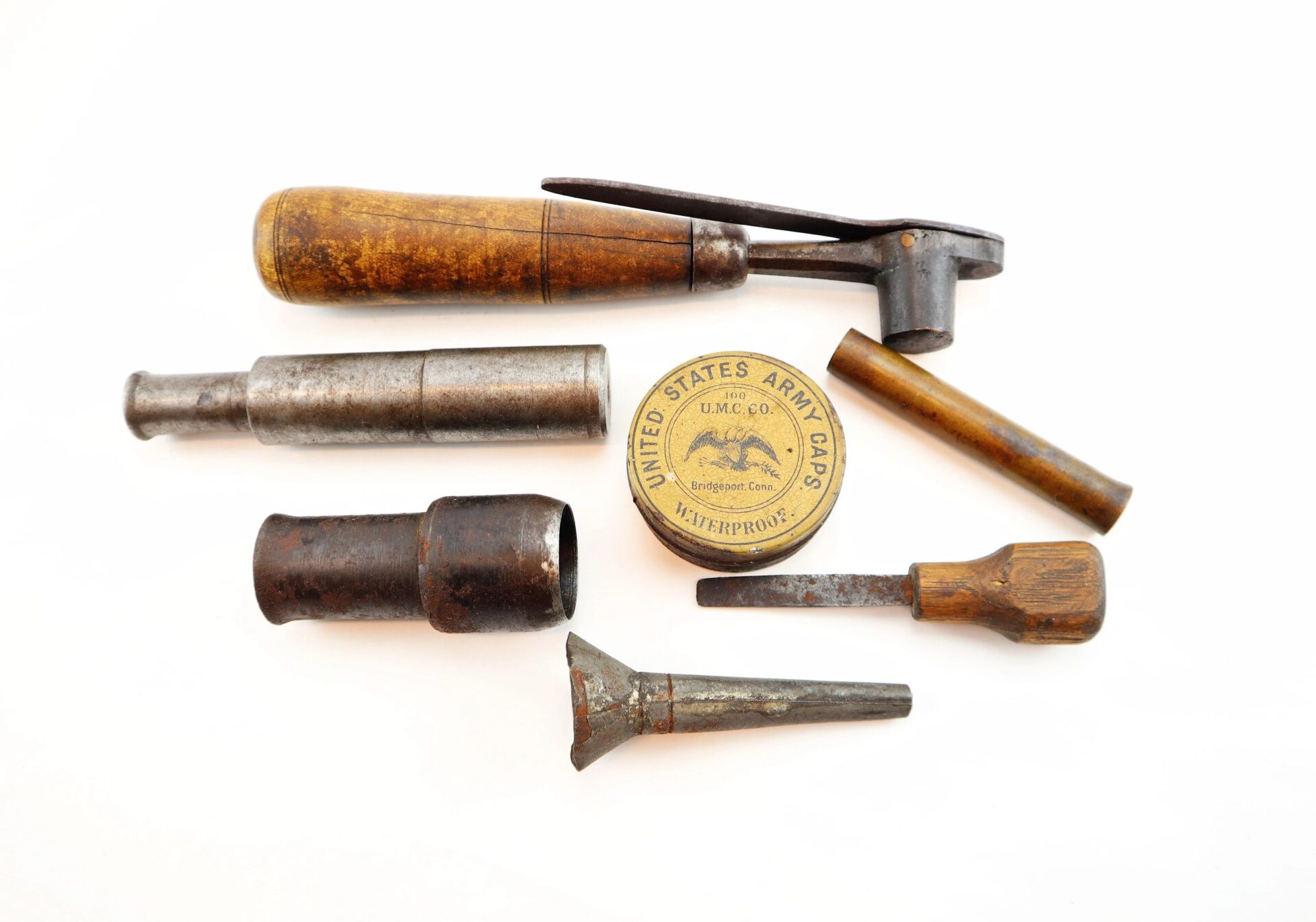 A vintage "Target Rifle" Box Sharpshooters display, featuring metal and wooden tools—hammer, screwdrivers, two cylinders, and a U.S. Army caps tin—shown on a white background.