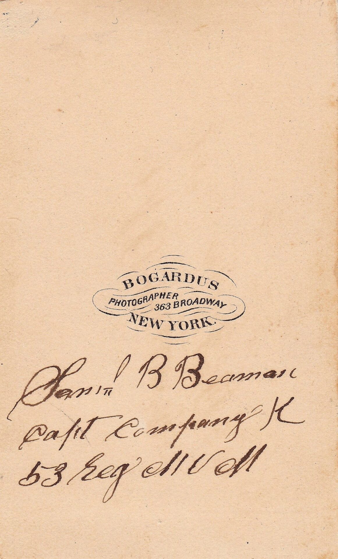 A sepia-toned CDV and silver badge of Captain Samuel B. Beaman/SOLD, stamped “Bogardus Photographer, 363 Broadway, New York” with handwritten script below.