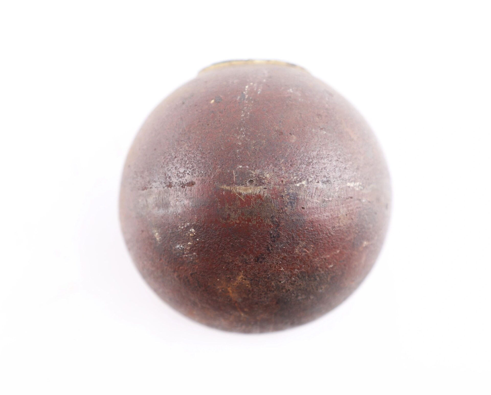 A single, round Confederate 6 Pound Borman Artillery Shell with a dark brown, slightly rough, weathered surface is photographed against a plain white background.