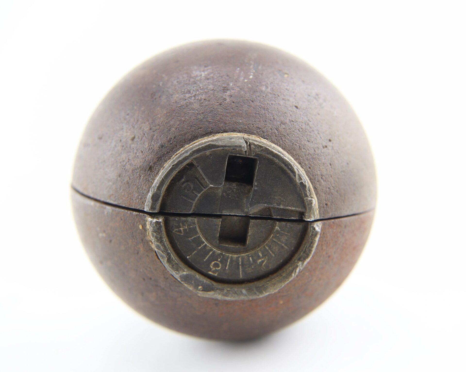 A Confederate 6 Pound Borman Artillery Shell, featuring a rusted spherical metal body with a marked rotating dial and front slots, displayed against a plain white background.