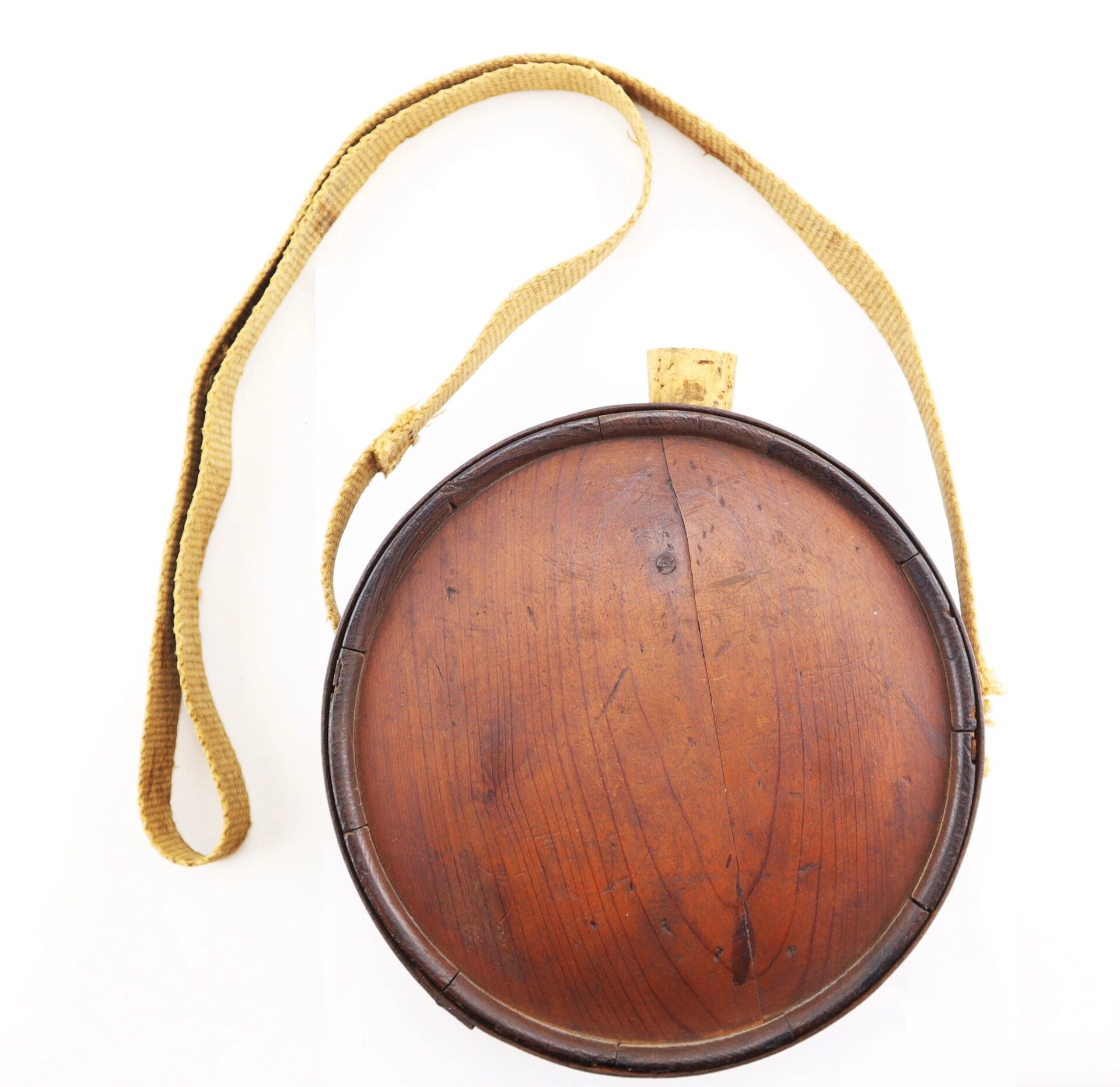 Confederate Wood Drum Canteen with cork stopper and woven fabric shoulder strap, shown against a white background.
