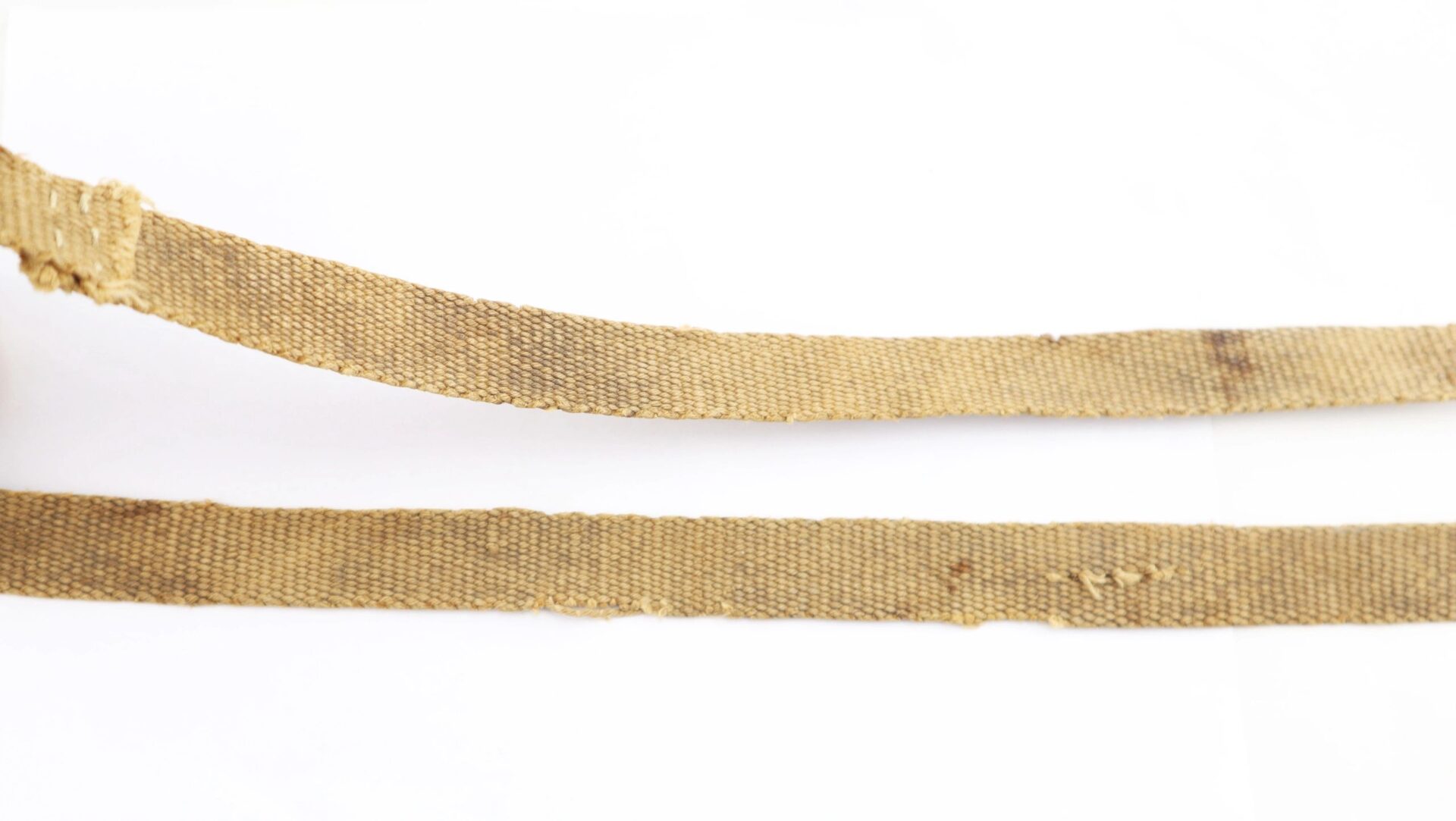 Two worn, frayed, light brown fabric straps from a Confederate Wood Drum Canteen (SOLD) are laid out horizontally on a white background.