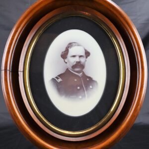 Full Plate Milk Glass Ambrotype of Lt. James H. Close, showing a black and white portrait of a man in military uniform, displayed in an oval wooden frame against a black background.