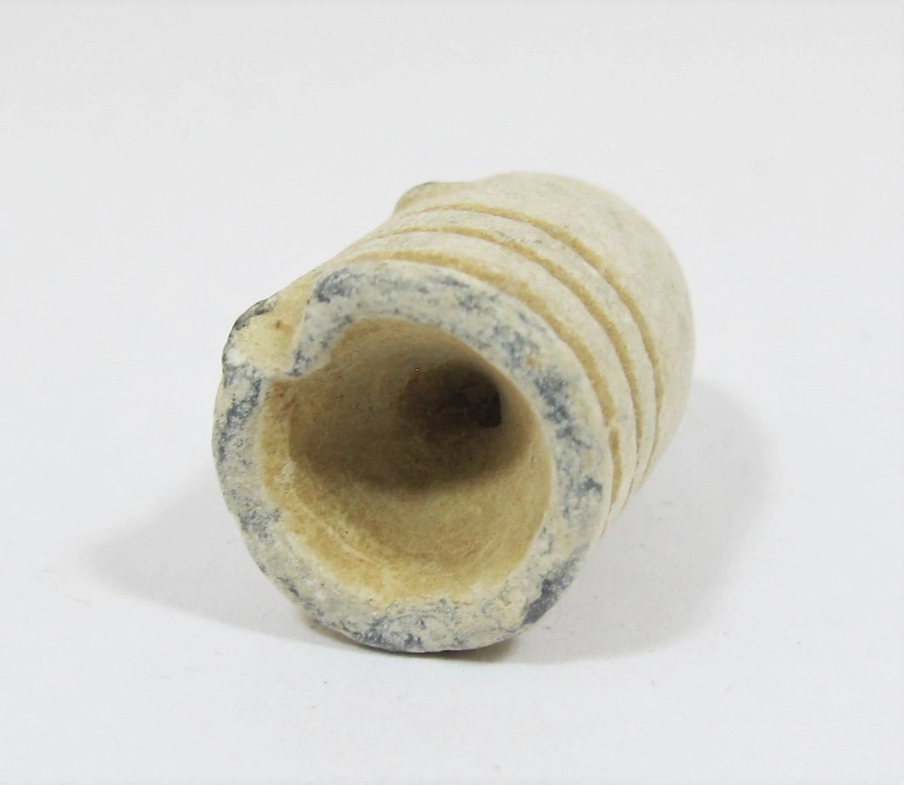Close-up of a single .58 Caliber 3-Ring Union Bullet from Gettysburg with a hollow base, displayed on a plain white background.