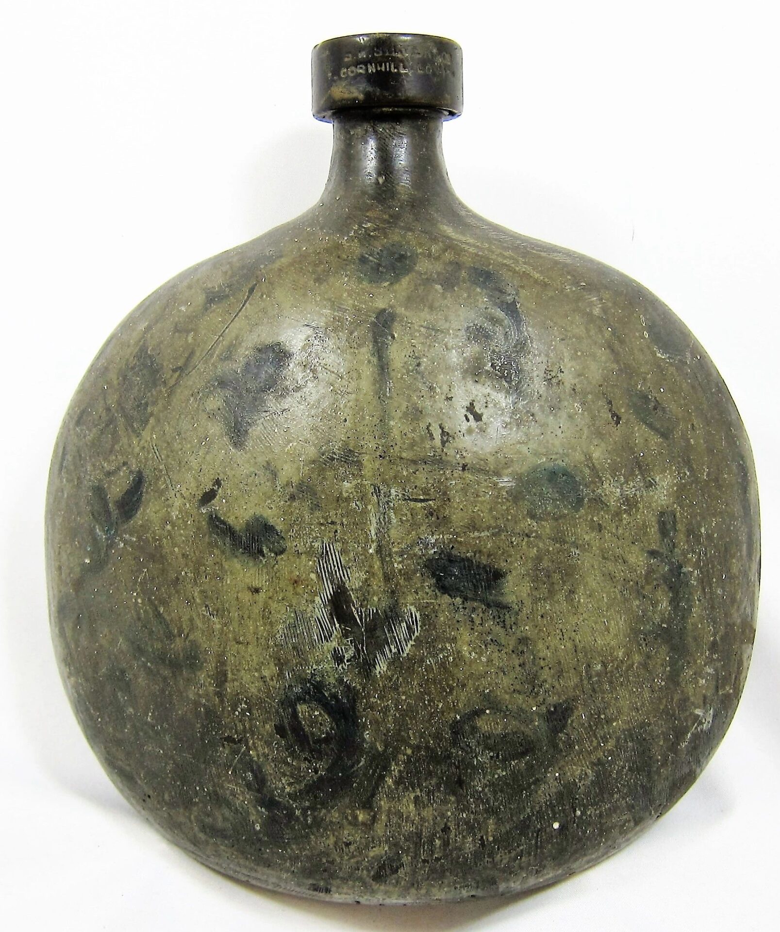 A Civil War Era Gutta-Percha canteen with a round shape and black cap.