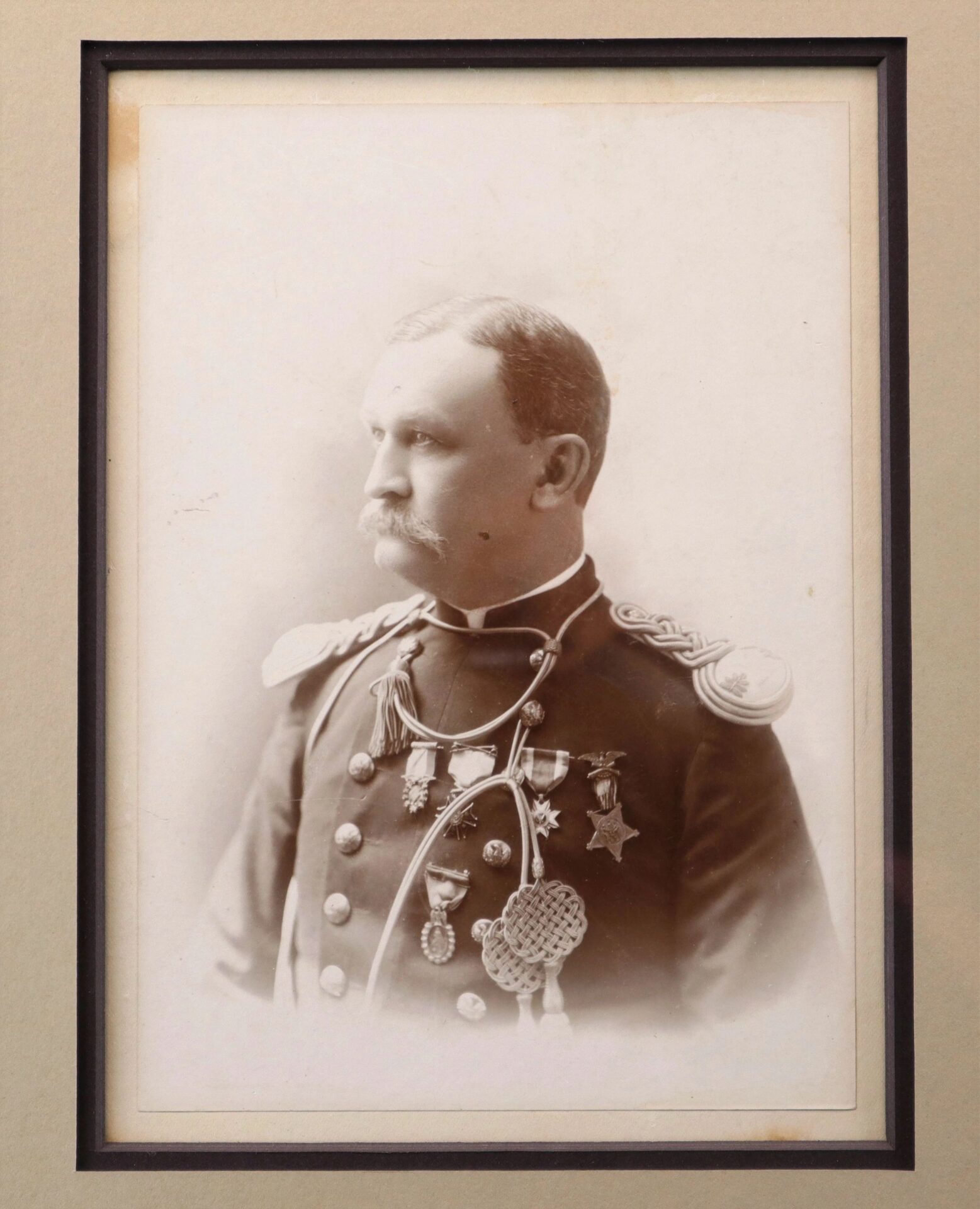 Sepia-toned portrait of Major Erasmus Corwin Gilbreath in a decorated military uniform with medals and shoulder epaulettes, facing slightly left.