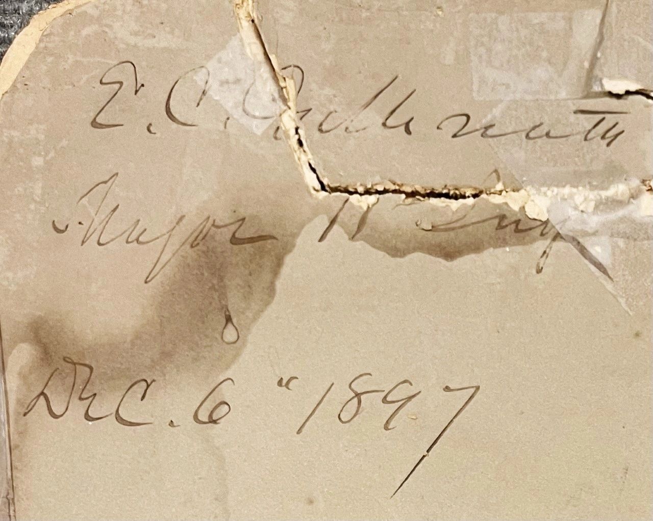 A cracked, aged paper with handwritten cursive text reads "Major Erasmus Corwin Gilbreath, Super Mt. Temp, Dec. 6th 1897.