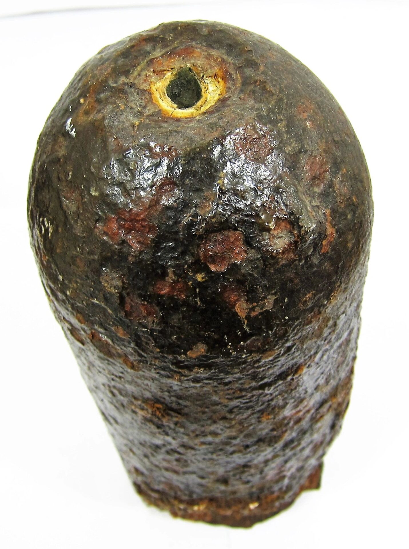 A Confederate Read / Sold artillery shell, cylindrical and rusted with a small hole at the top, is displayed against a plain white background.