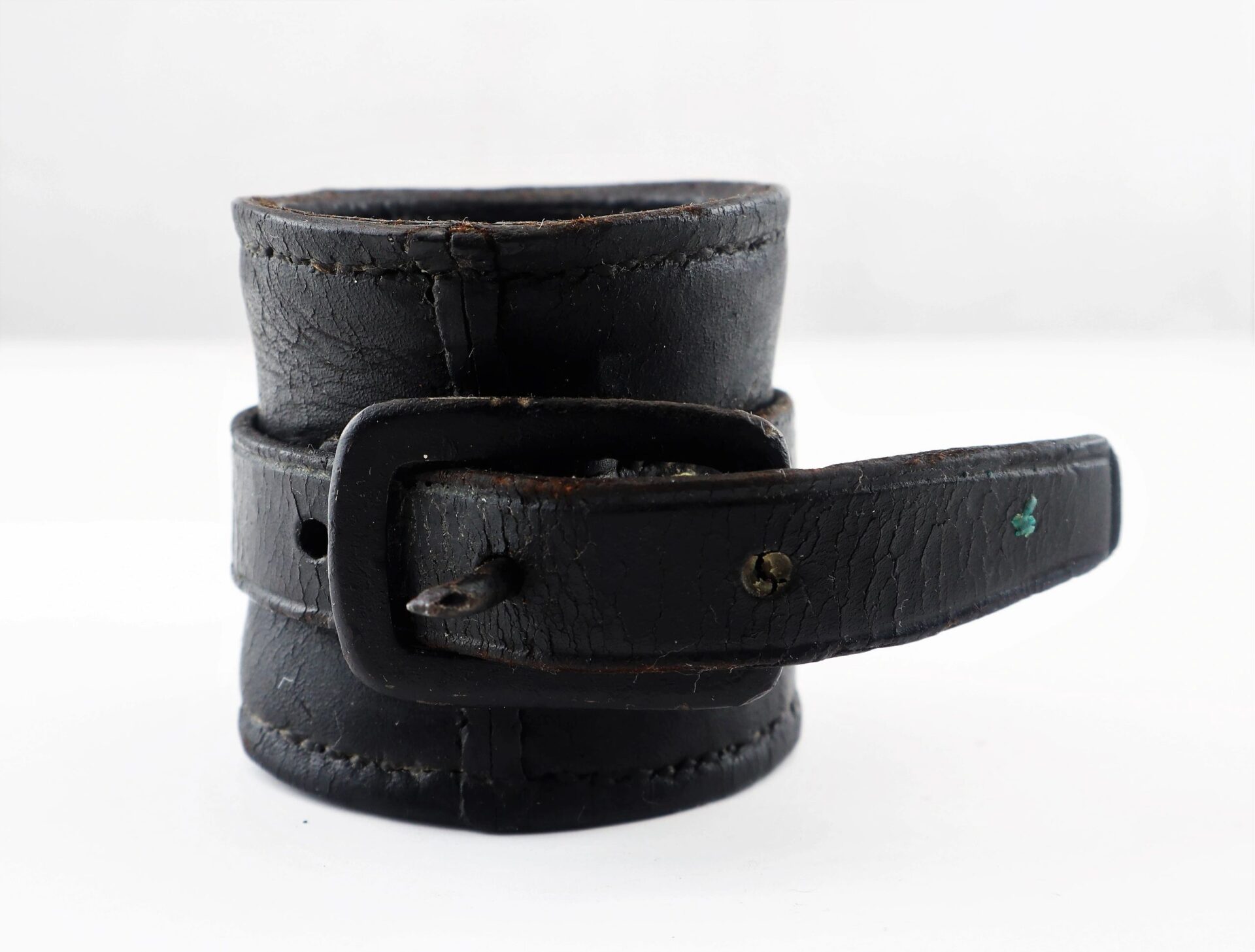 A close-up of the Civil War Cavalry Carbine Boot, showing its worn black leather with a buckle and visible stitching, set against a plain white background.