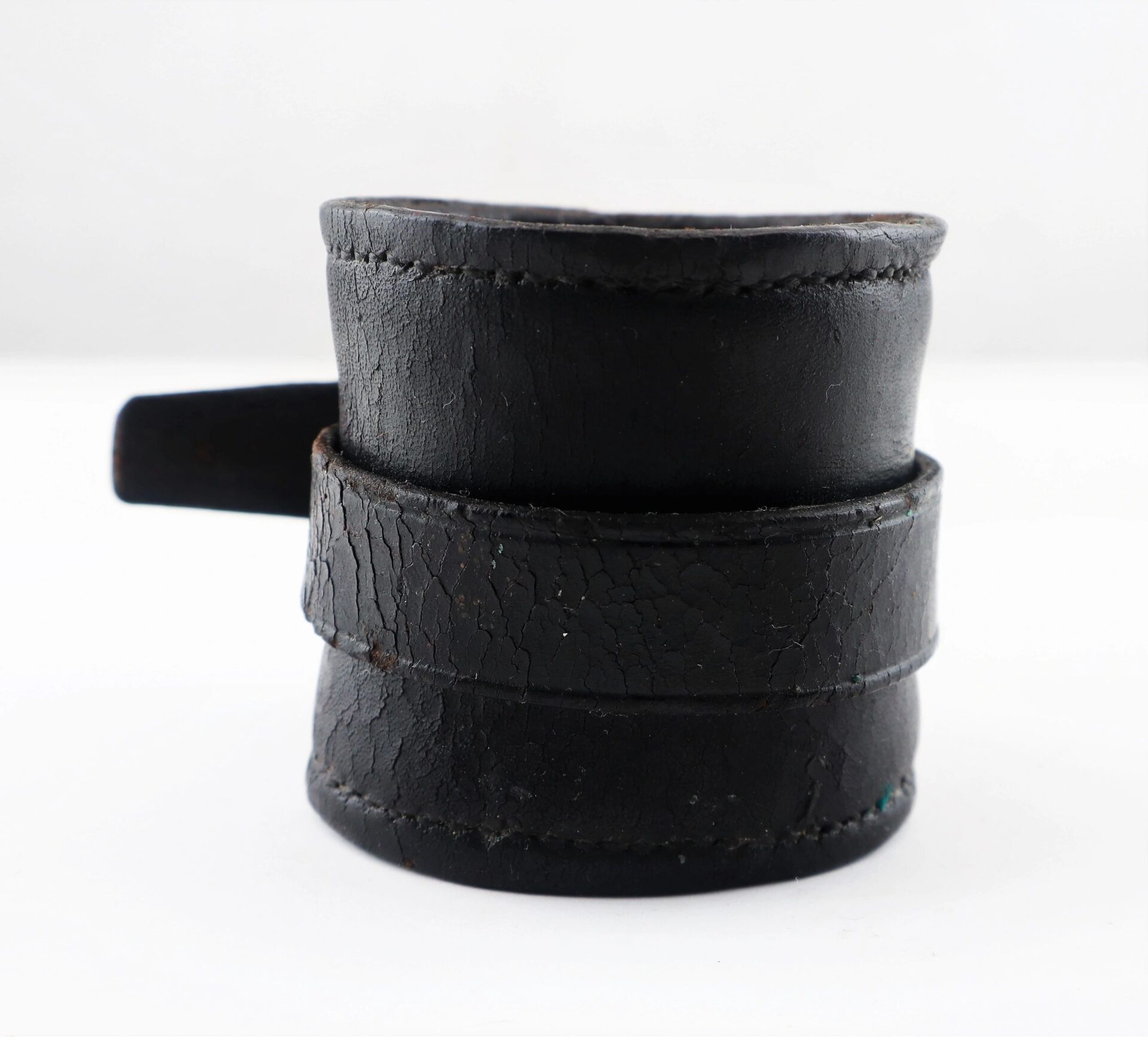 A close-up of the Civil War Cavalry Carbine Boot, featuring worn black leather with visible stitching and cracks, set against a plain white background.