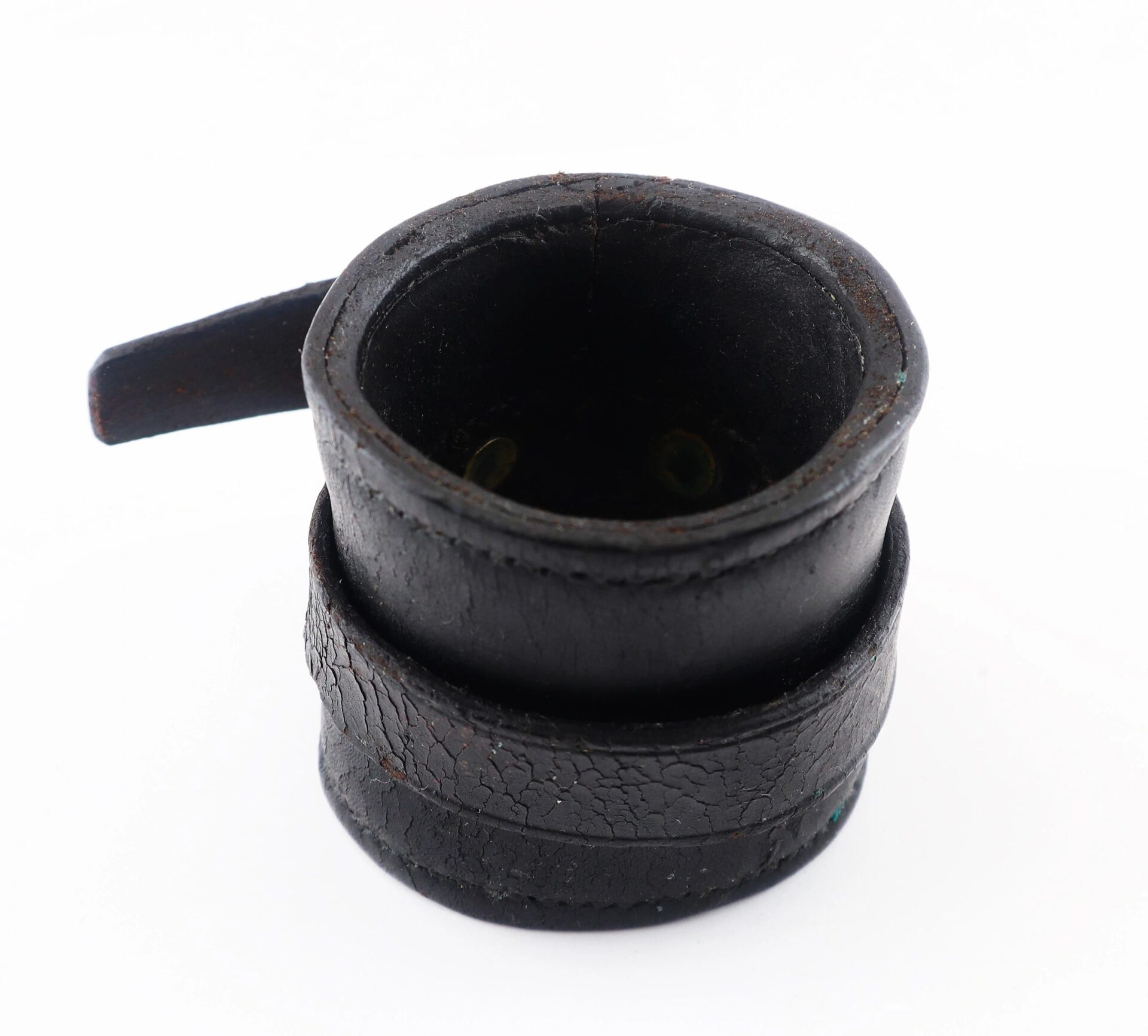 A Civil War Cavalry Carbine Boot, small and round with black leather and a textured surface, featuring a spout, is shown against a white background.