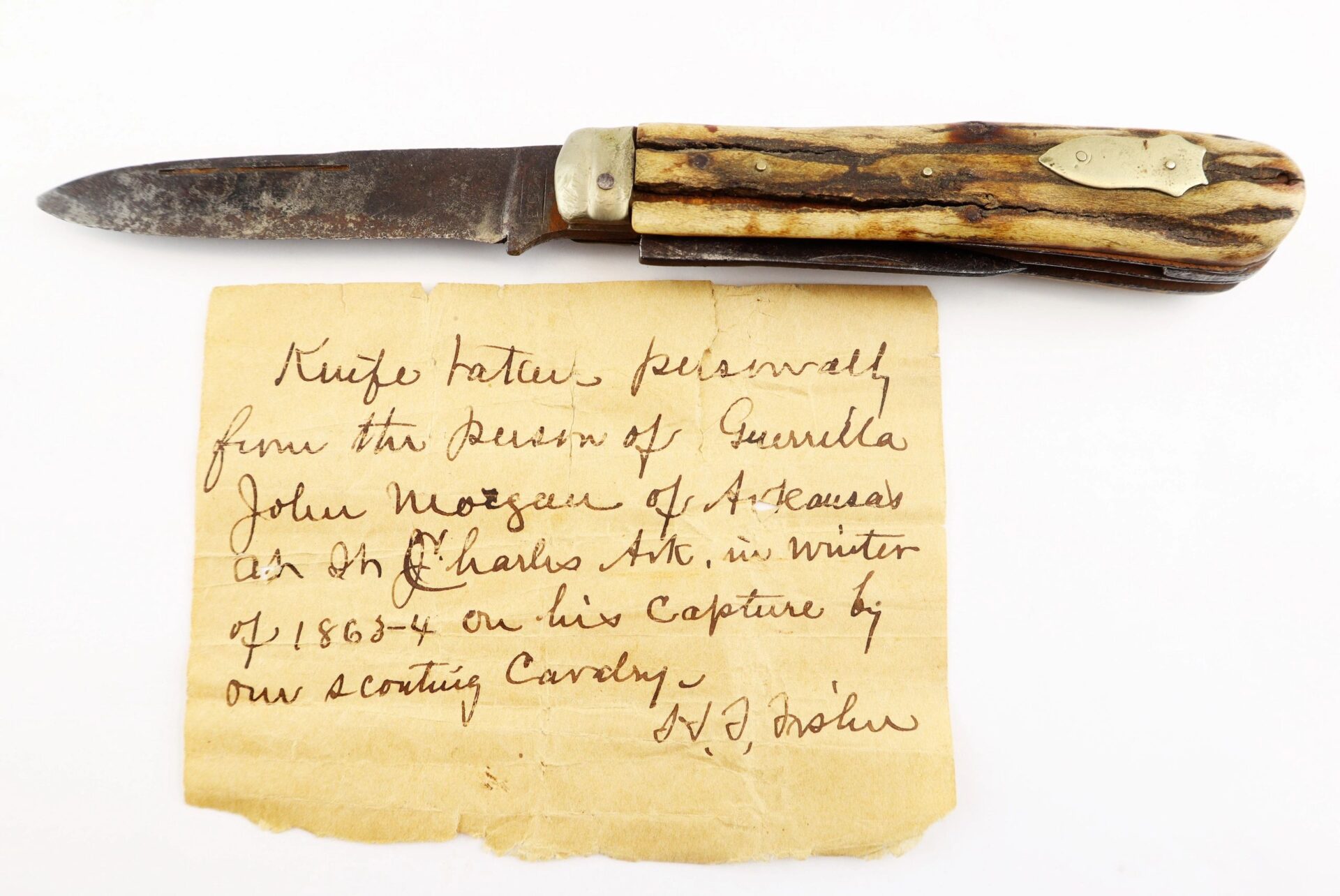 The John Hunt Morgan Knife and Grouping, ID’d to Hiram T. Fisher (16th Ohio & 53rd USCT / SOLD), is displayed above a handwritten note detailing its history and previous ownership.
