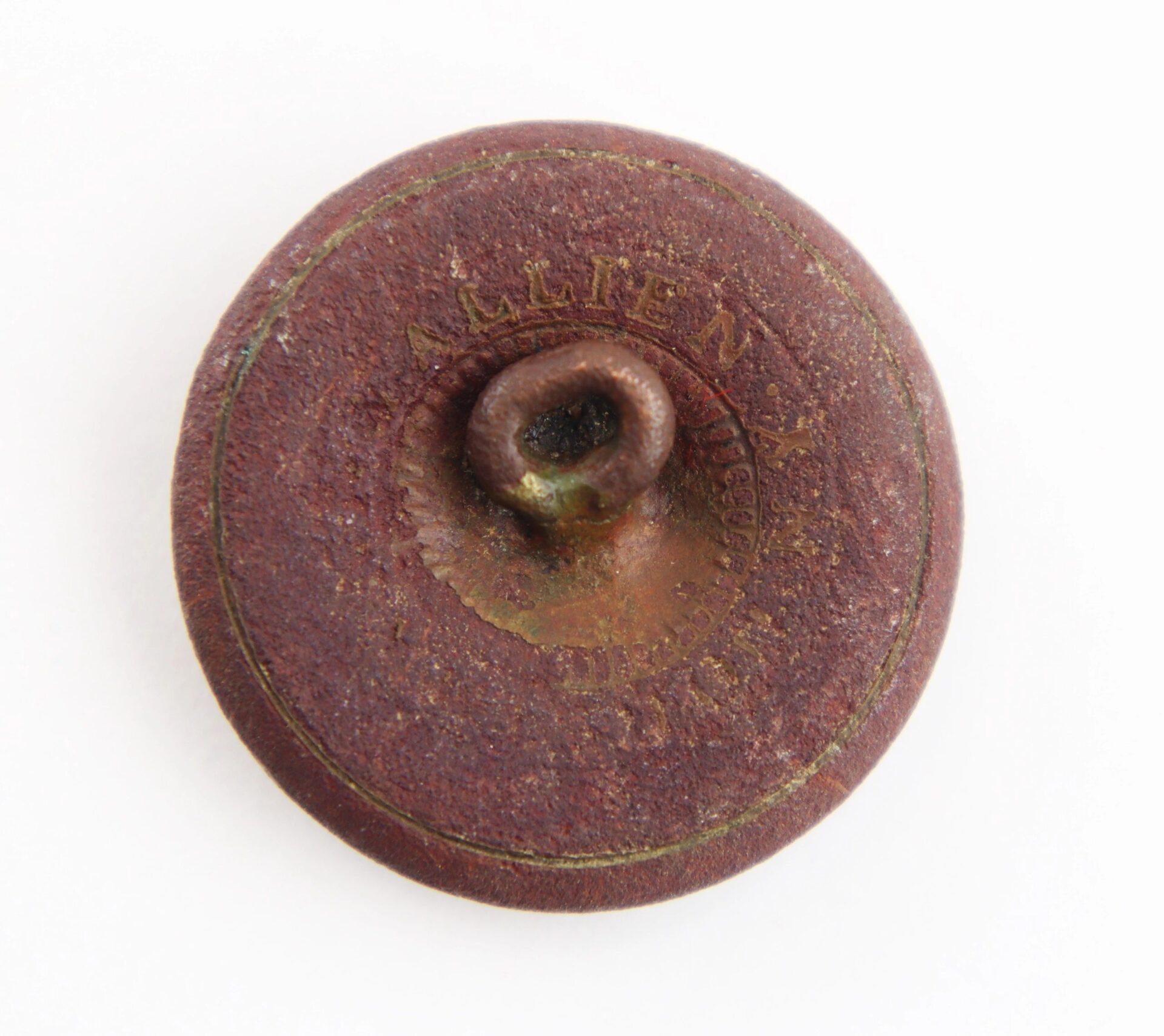 Round, rusted South Carolina Coat Button from the Battle of Gettysburg with a loop shank and worn "ALLEN" engraving, shown on a white background.