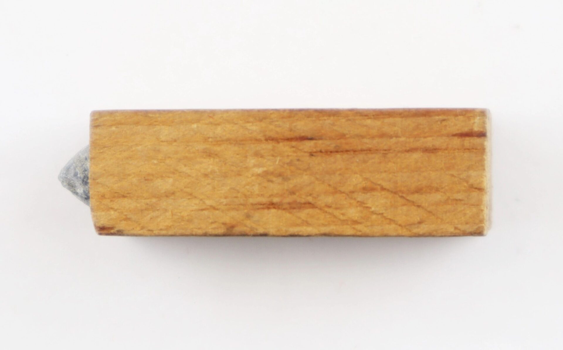 Close-up of the wooden side of a .36 Caliber Navy Cartridge with the tip partially visible on the left, set against a white background. Marked as SOLD.