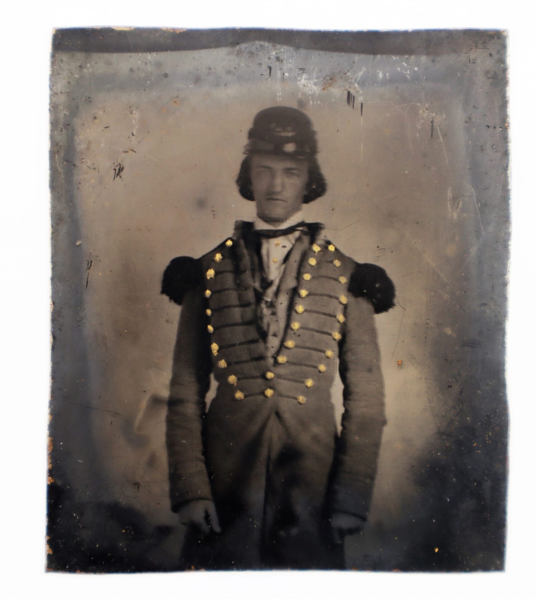 A 1/6 plate ambrotype featuring a Southern militiaman in a military-style uniform with decorative buttons and shoulder epaulettes, standing and facing the camera.