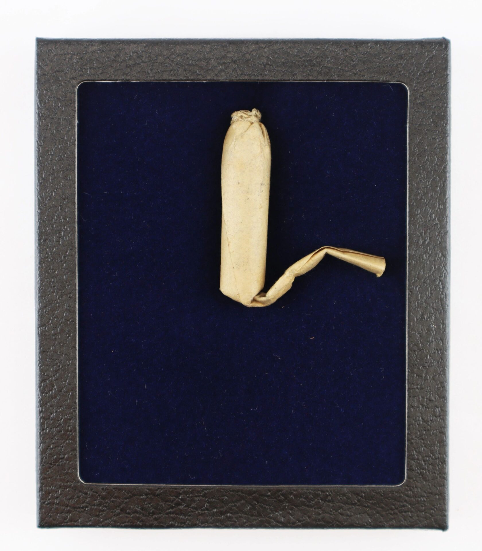 A single, unused Civil War .58 Caliber Minie Ball cartridge displayed in a black frame with a dark blue background.