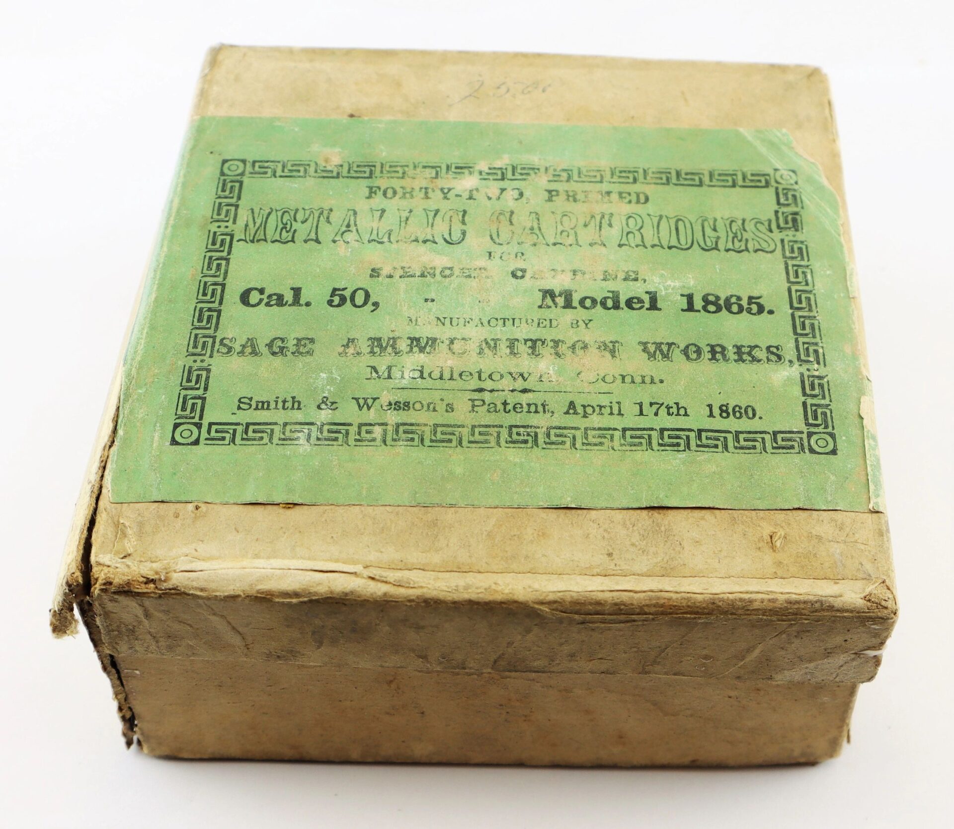 A worn cardboard box labeled "Complete Box of 1865 Spencer Cartridges" from Sage Ammunition Works, Middletown, Conn., dated April 17th, 1860.
