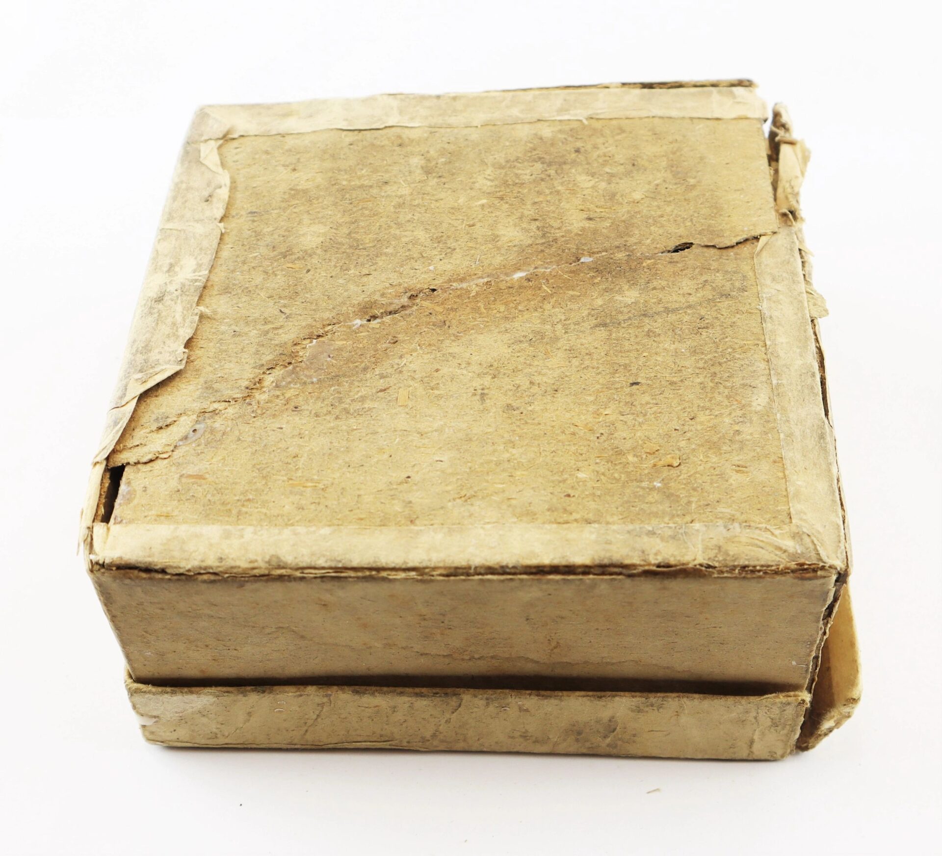 A worn cardboard box labeled "Complete Box of 1865 Spencer Cartridges" with visible creases and torn edges, shown against a plain white background.