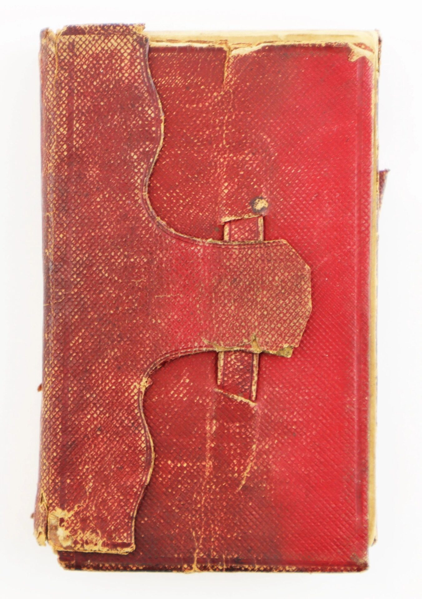A worn red leather-bound "Discharges, Bible, and Reunion Ribbons of David R. Weaver 30th NJ Infantry and Battery D, 1st NJ Light Artillery" book with textured cover, scuffs, ornate flap clasp; shows age and use. SOLD.