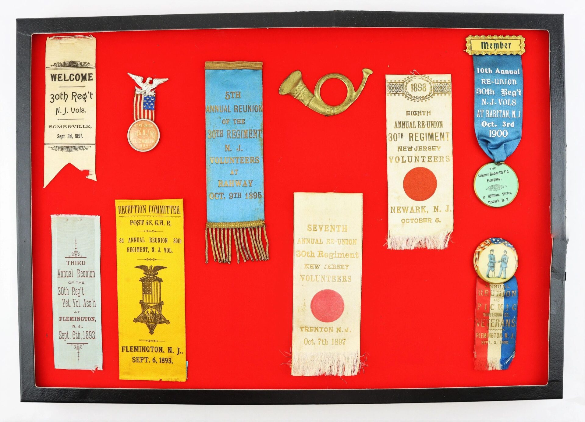Display case featuring discharges, Bible, and reunion ribbons of David R. Weaver, 30th New Jersey Infantry and Battery D, 1st NJ Light Artillery. Items are attractively arranged and commemorate his service. / SOLD.