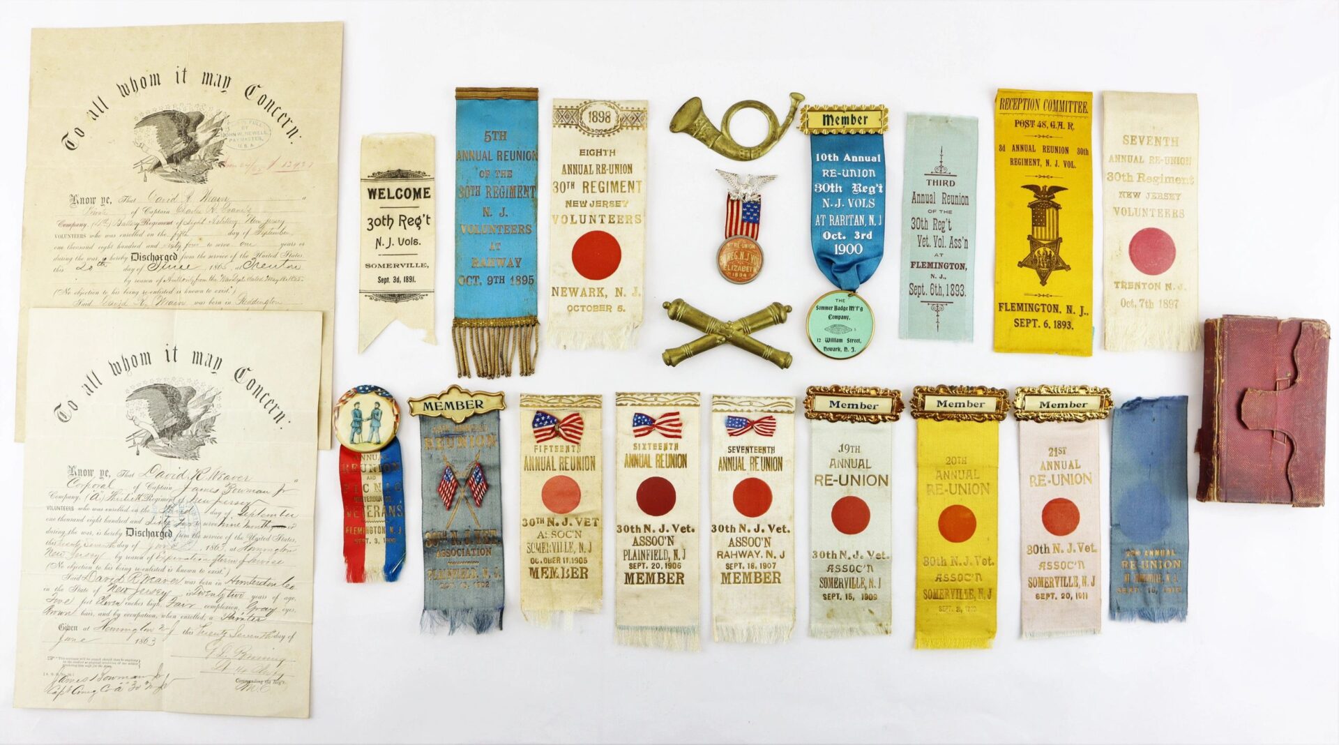 Discharges, Bible, and reunion ribbons of David R. Weaver, 30th NJ Infantry & Battery D, 1st NJ Light Artillery displayed on a white background. / SOLD.