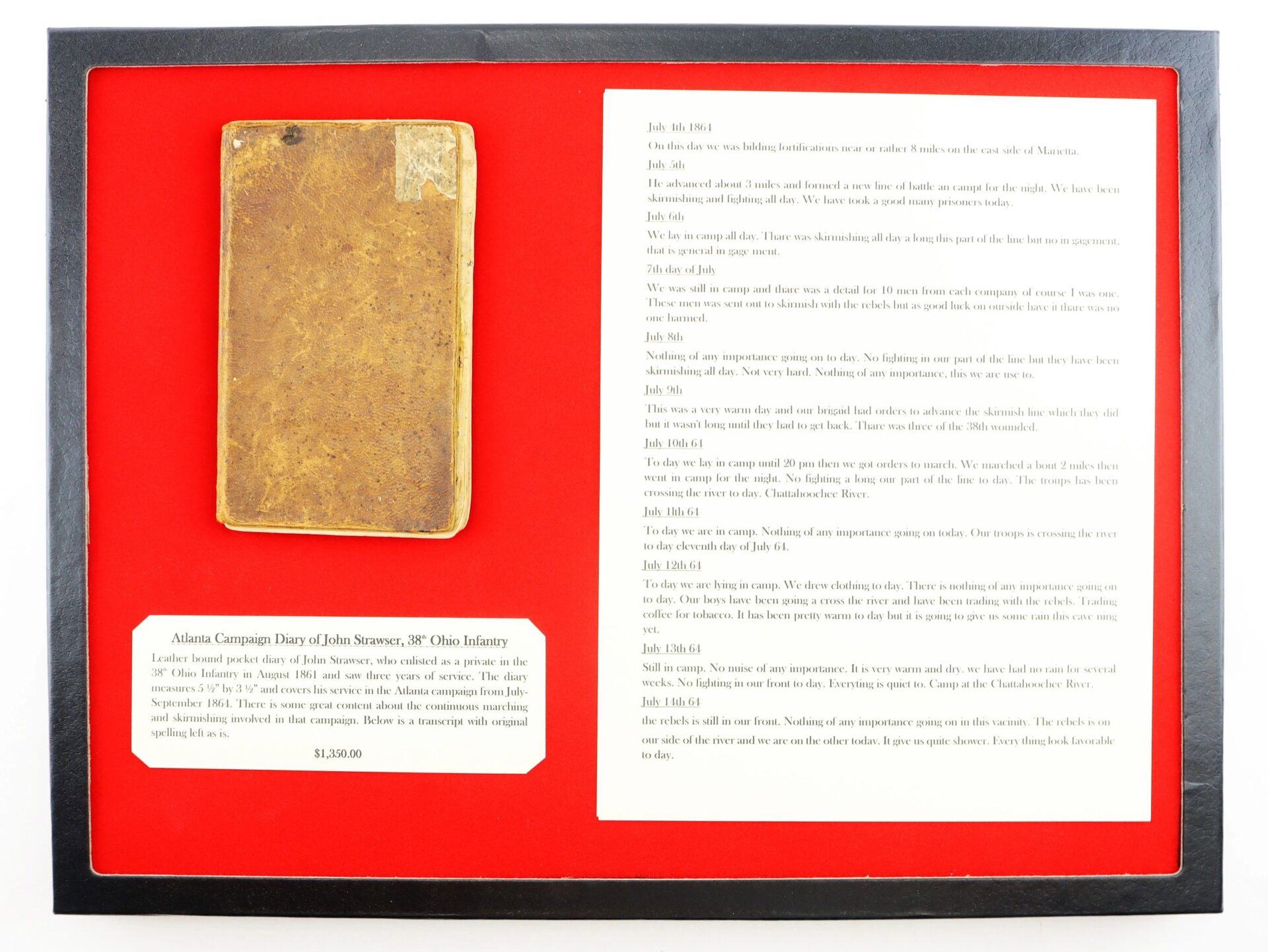 Framed display featuring the worn, brown "Atlanta Campaign Diary of John Strawser, 38" Ohio Infantry" on the left, printed diary excerpts on the right, and a descriptive plaque below, all set against a red background.