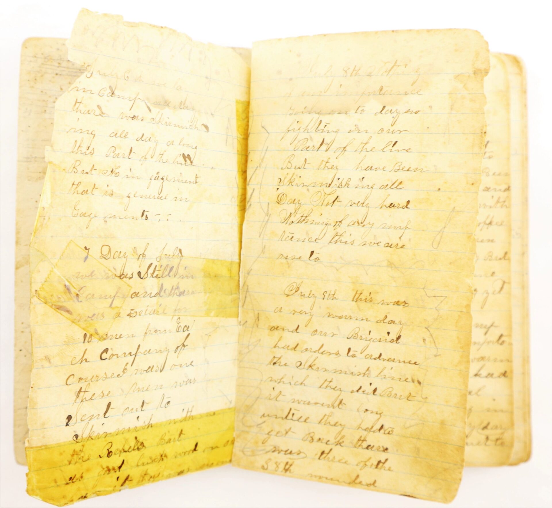 An open, aged, and yellowed Atlanta Campaign Diary of John Strawser, 38" Ohio Infantry, with faded handwritten text on lined pages and visible tape repairs.