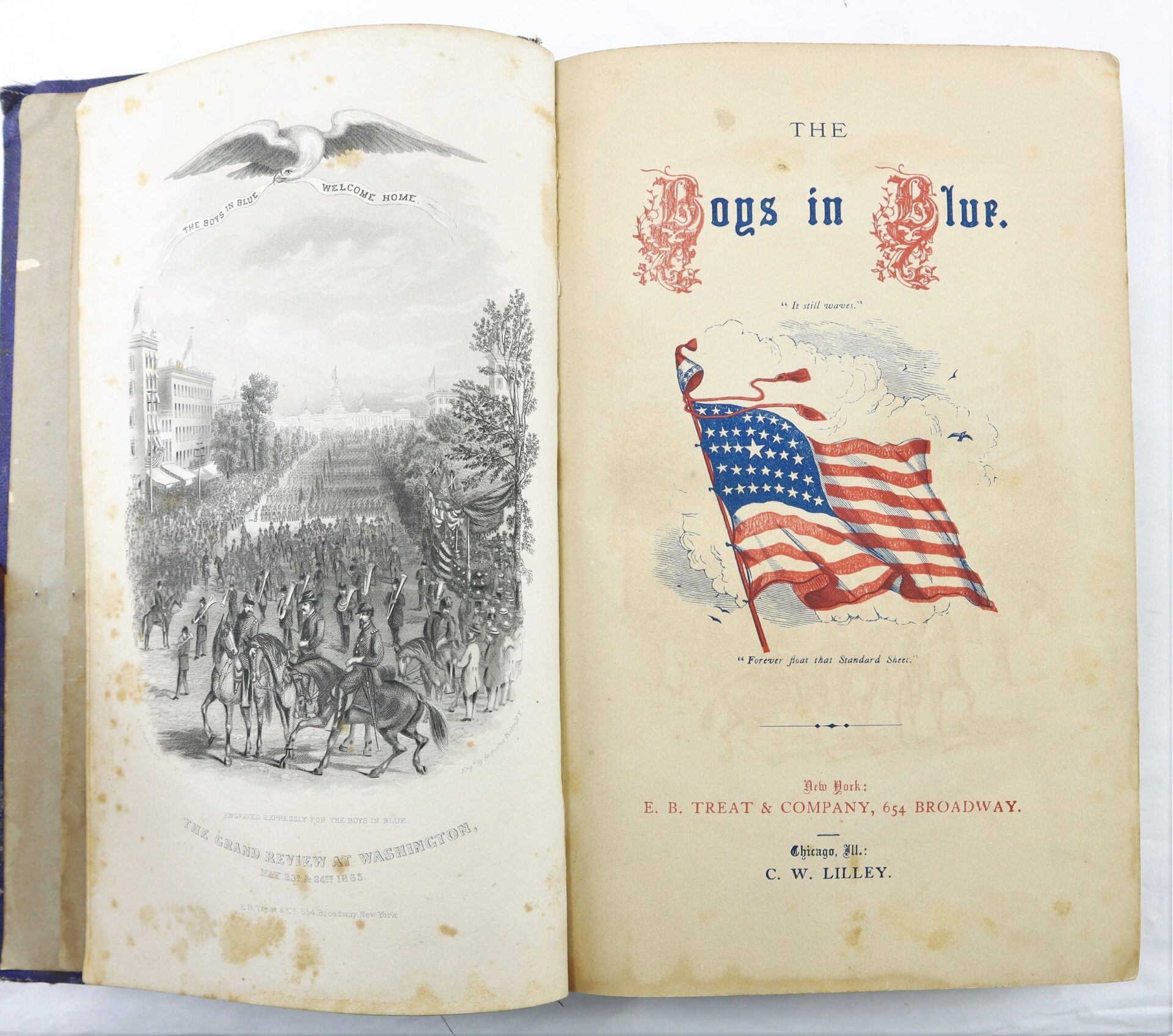 Open book displaying a black and white illustration of soldiers entering Washington and the title page of "The Boys in Blue by A. H. Hoge / SOLD," featuring a waving American flag and publishing details.