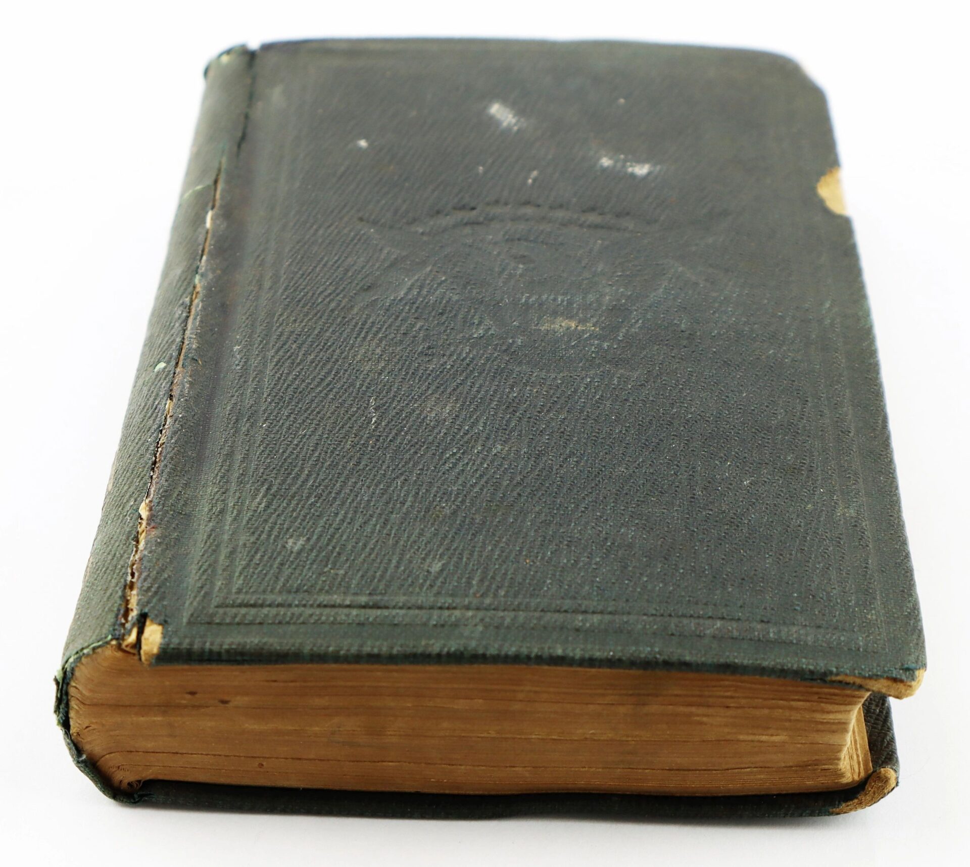 A worn, closed hardcover of "Casey’s Infantry Tactics Identified to Charles H. Bliven, 13th New Jersey Infantry / SOLD" features a dark green textured cover and yellowed pages, showing age and edge wear.