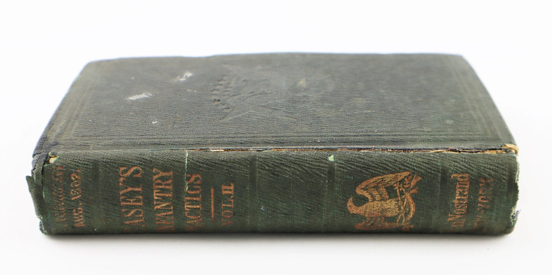 A worn, dark green hardcover, "Casey’s Infantry Tactics Identified to Charles H. Bliven, 13th New Jersey Infantry / SOLD," lies closed with frayed edges and gold spine lettering.