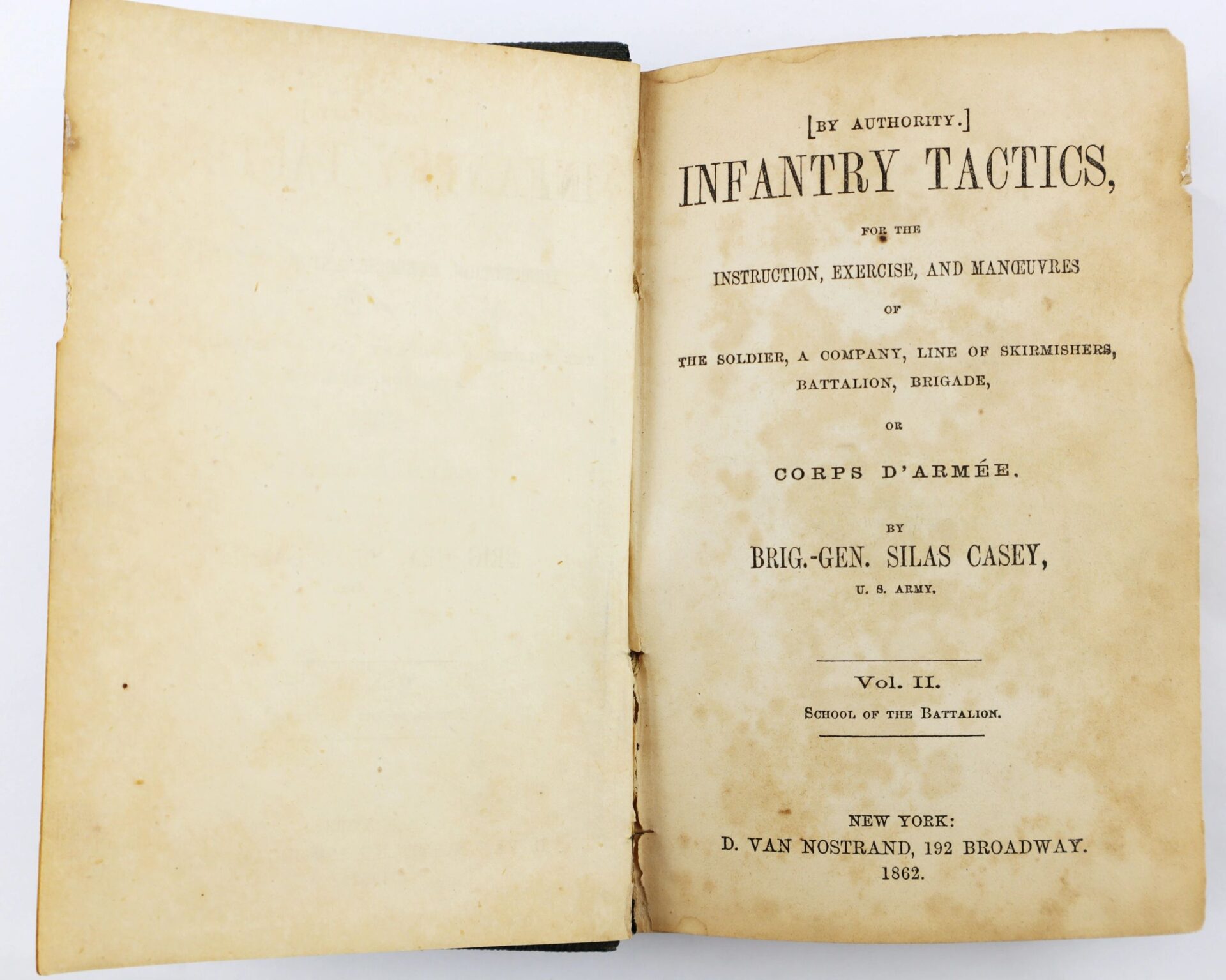 An open antique book, “Casey’s Infantry Tactics Identified to Charles H. Bliven, 13th New Jersey Infantry / SOLD,” published in 1862 by D. Van Nostrand, New York.