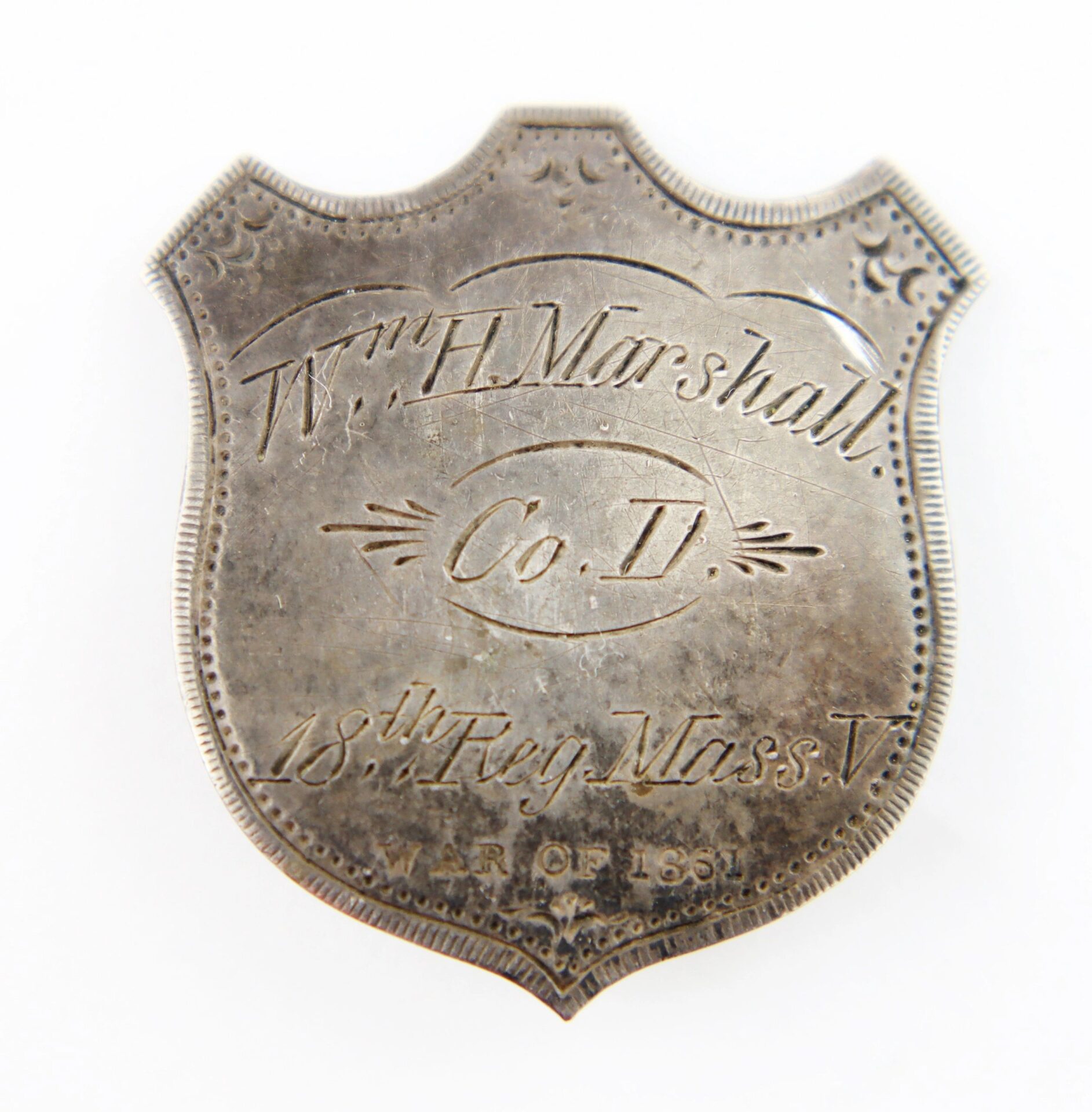 A shield-shaped silver badge for Private William Harlow Marshall, 18th Massachusetts Infantry, Battle of Gettysburg veteran.