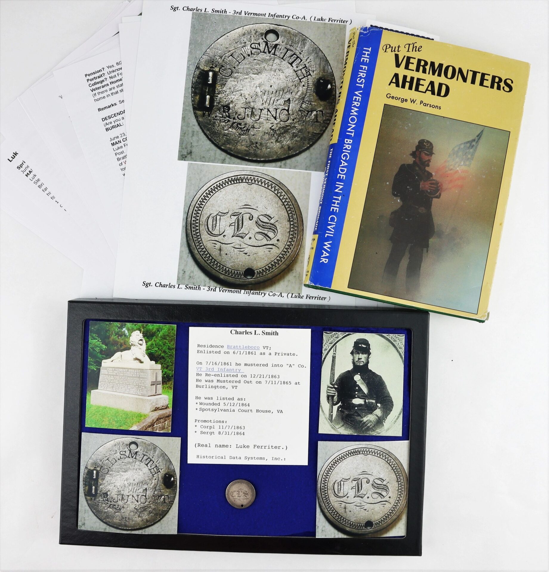 Display featuring the Love Token Identification Disk of Charles L. Smith, 3rd Vermont Infantry, wounded at Spotsylvania and connected to the famous “Sleeping Sentinel” Abraham Lincoln pardon, along with related documents and images.