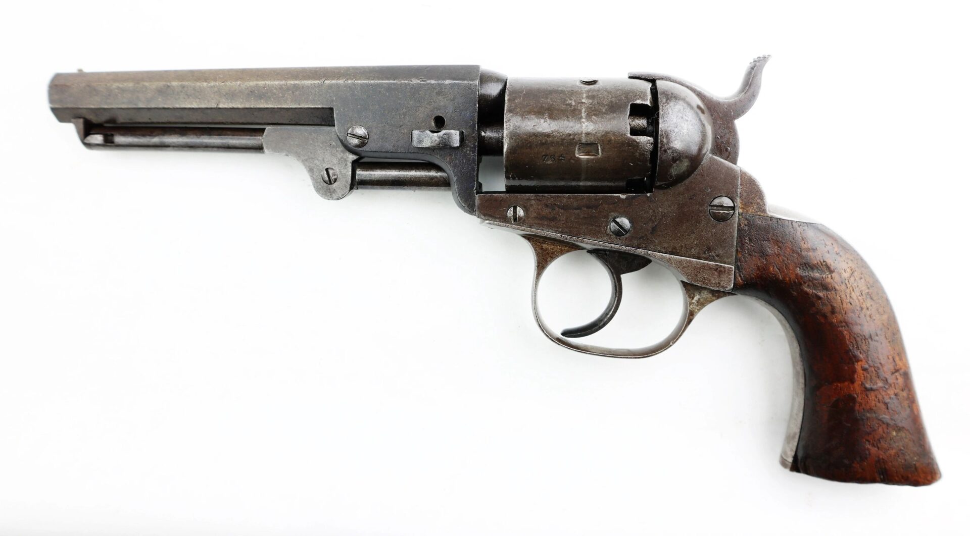 J. M. Cooper Pocket Model Revolver with a metal barrel and cylinder, plus a wooden grip, displayed on a white background.