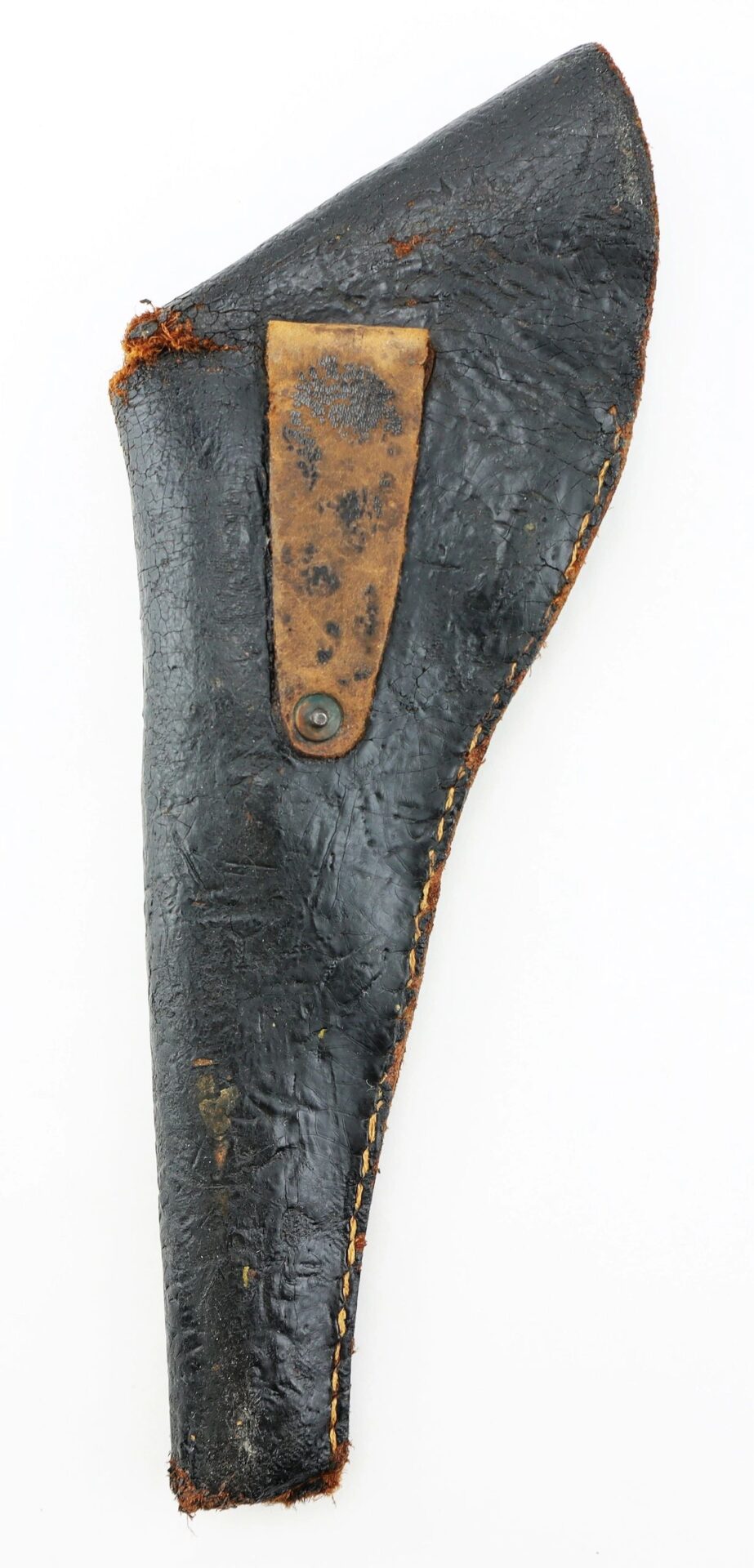 A worn Confederate Holster made of black leather, featuring visible stitching and a brown strap secured with a metal rivet.